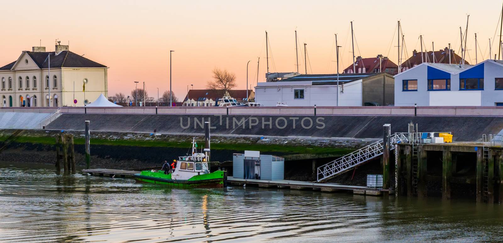 Docked boat with workers in the harbor of Blankenberge, Belgium, popular european city
