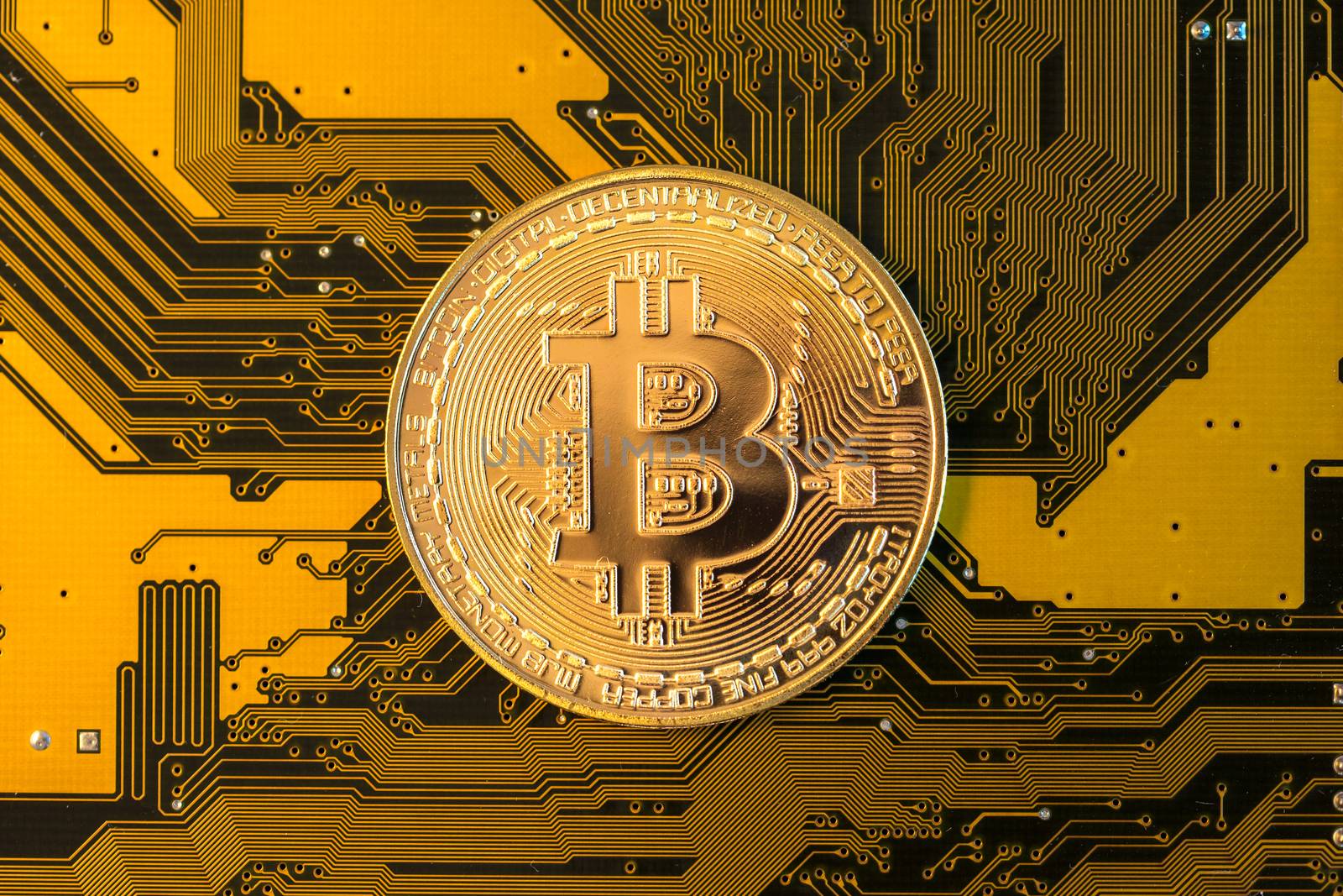 Mining Bitcoin concept - ,gold coin on a yellow PCB by petrsvoboda91