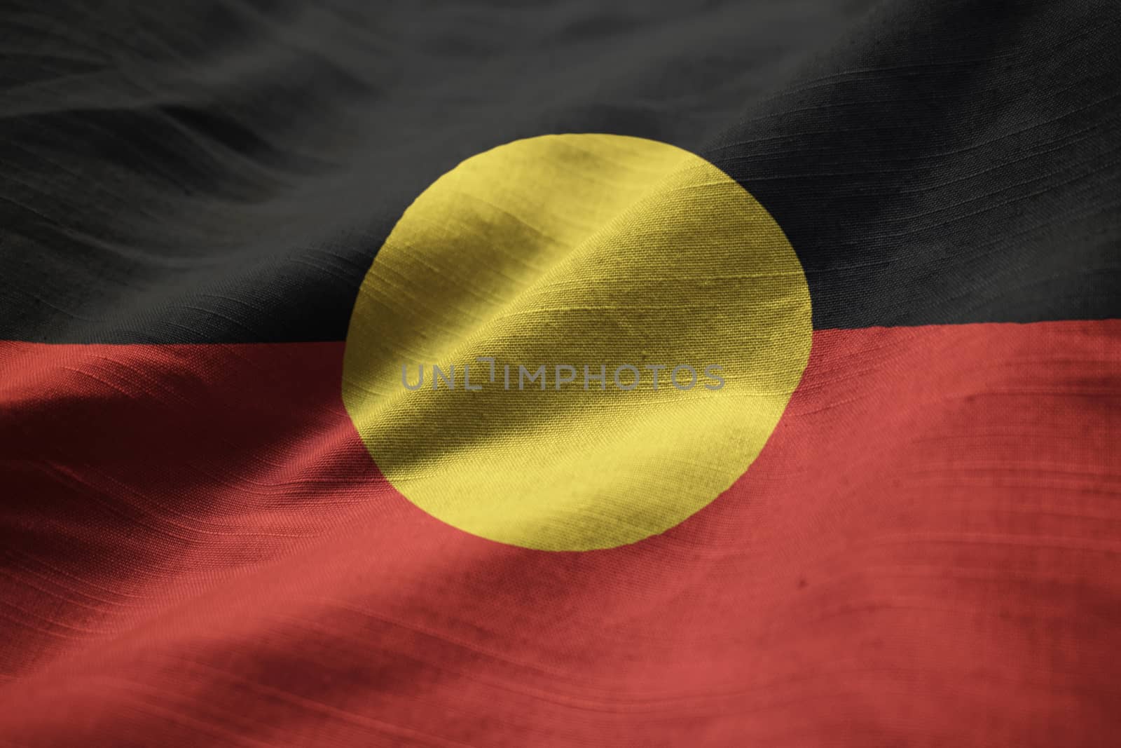 Closeup of Ruffled Australian Aboriginal Flag, Australian Aborig by shaadjutt36