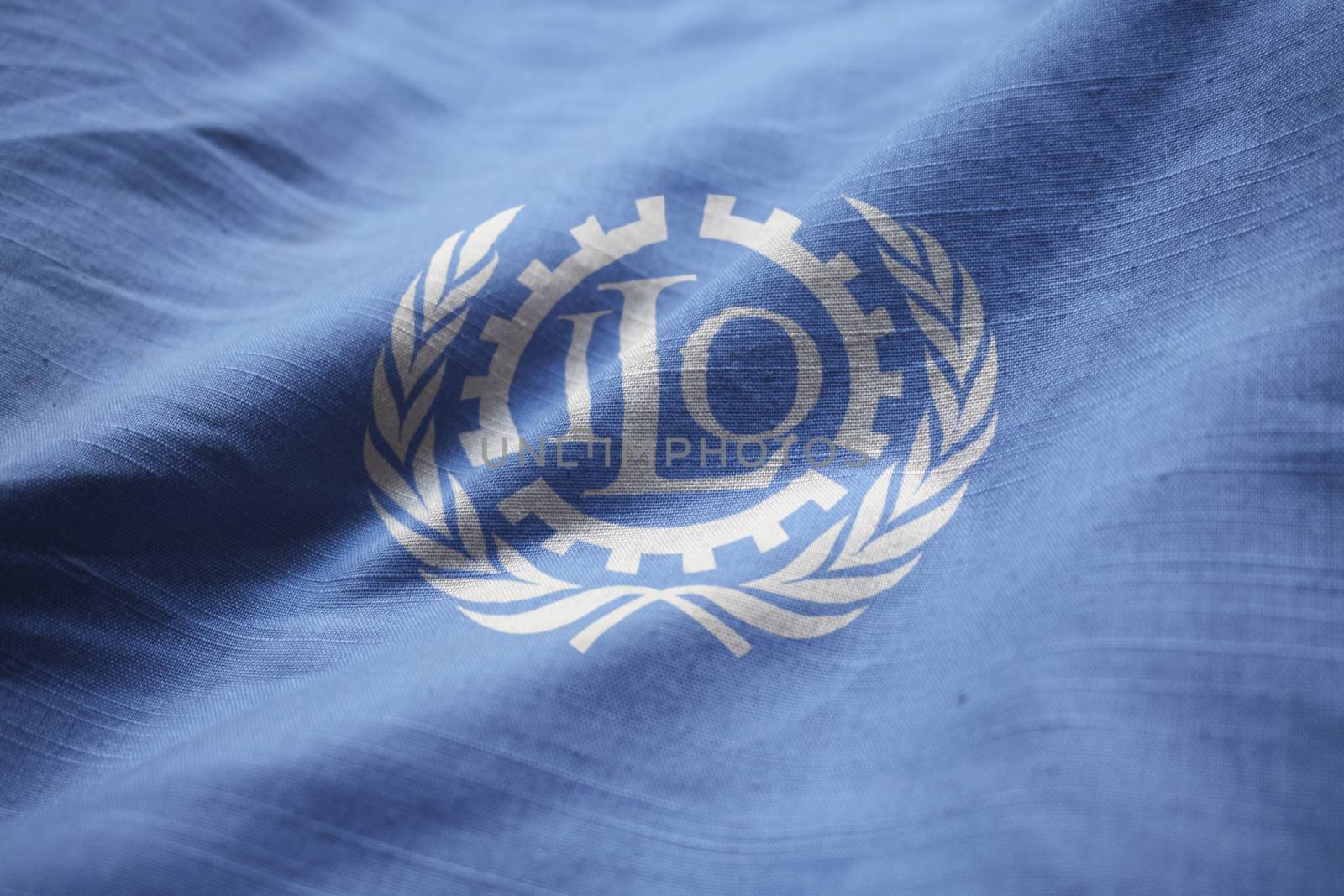 Closeup of Ruffled International Labour Organization Flag, International Labour Organization Flag Blowing in Wind