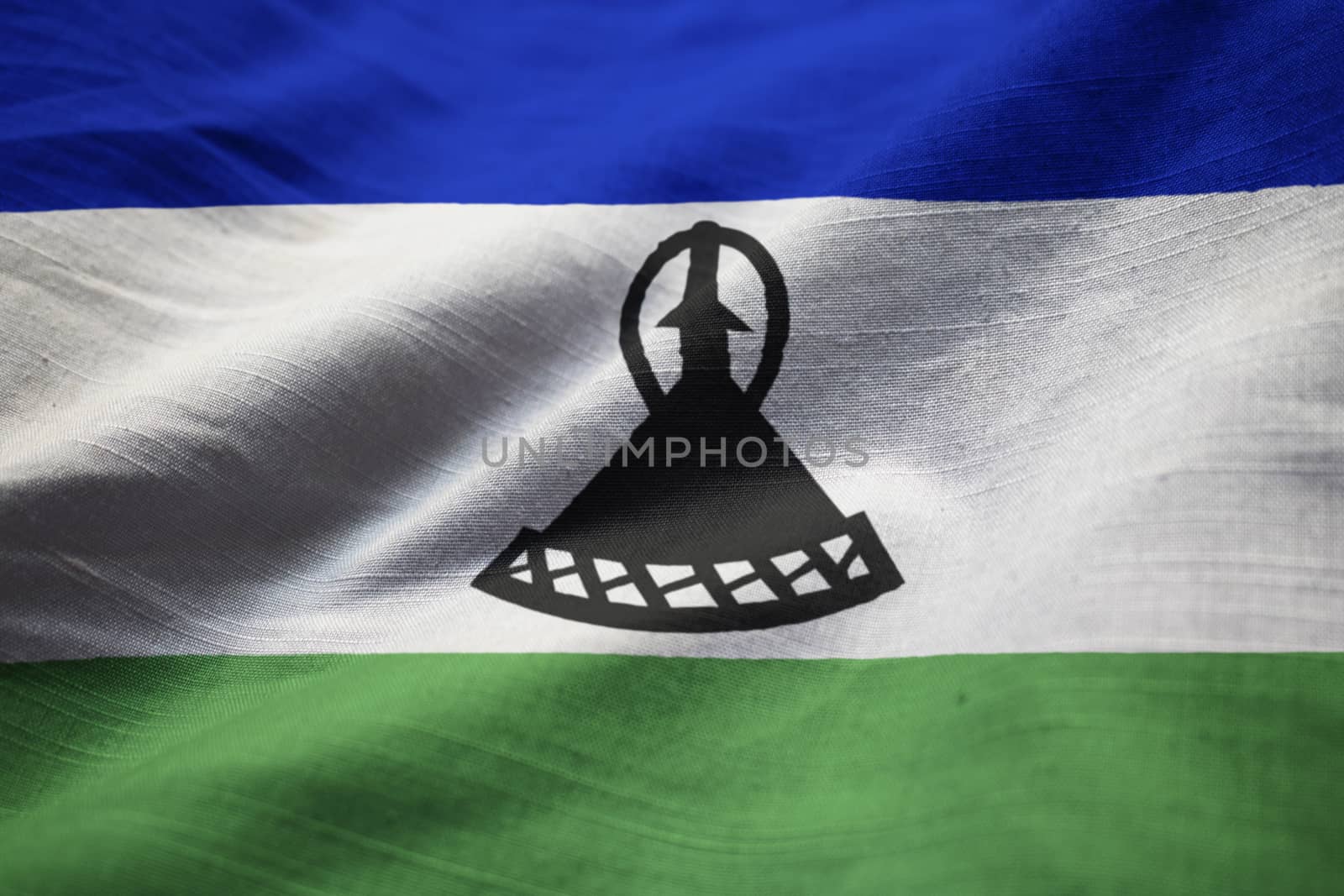 Closeup of Ruffled Lesotho Flag, Lesotho Flag Blowing in Wind by shaadjutt36