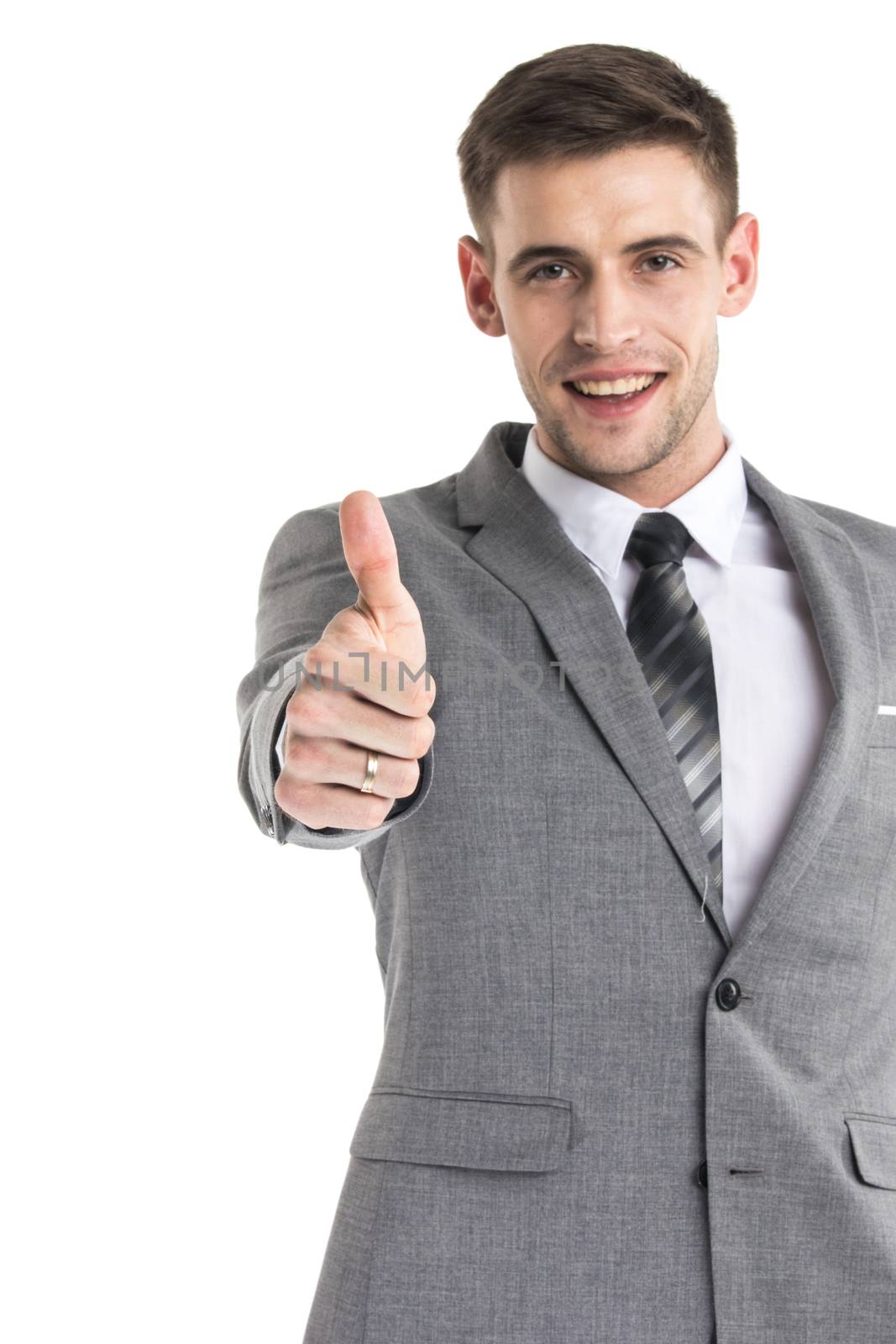 Happy young businessman with thumbs up sign isolated on white background