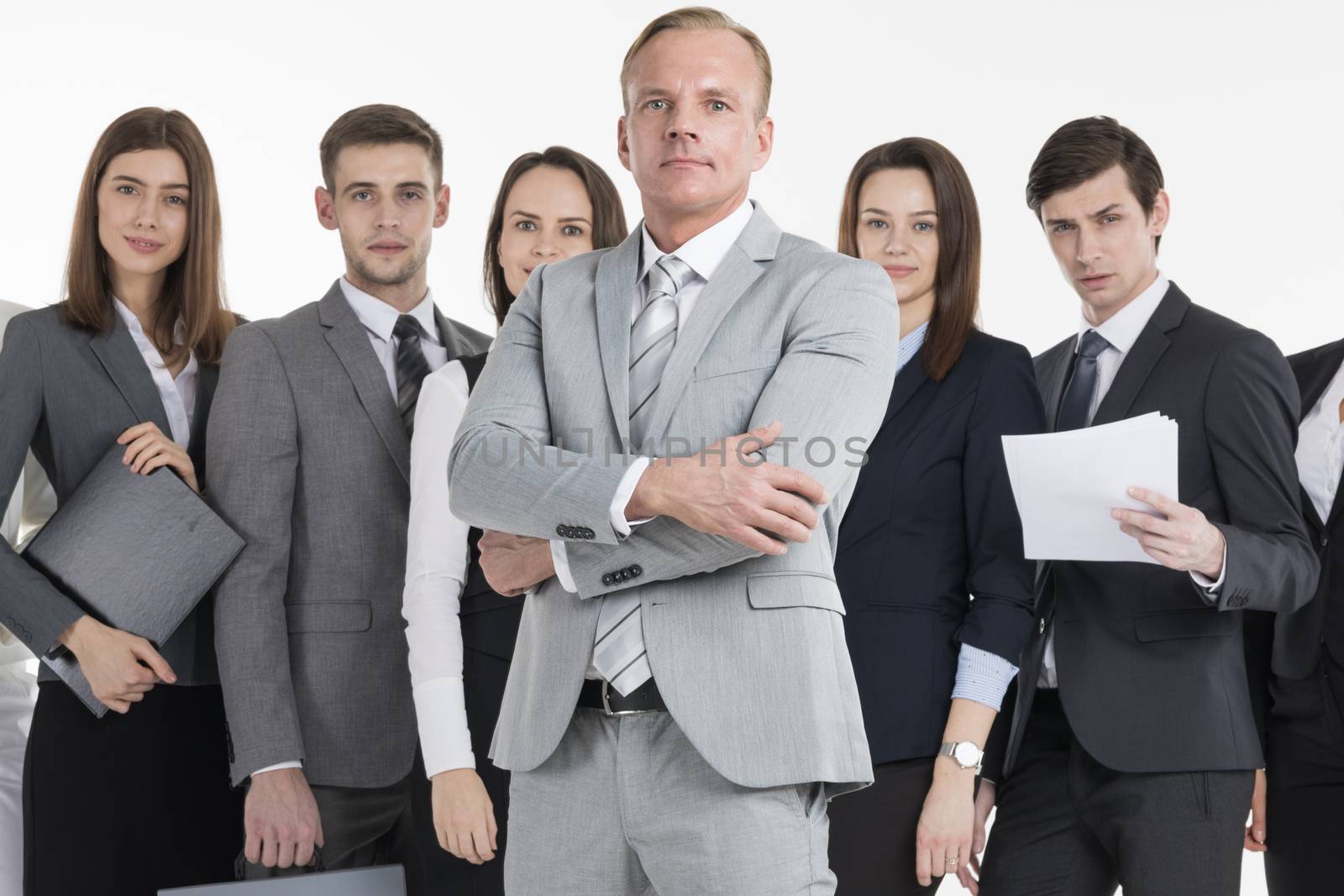 Group of business people holding documents. Business team isolated over white background