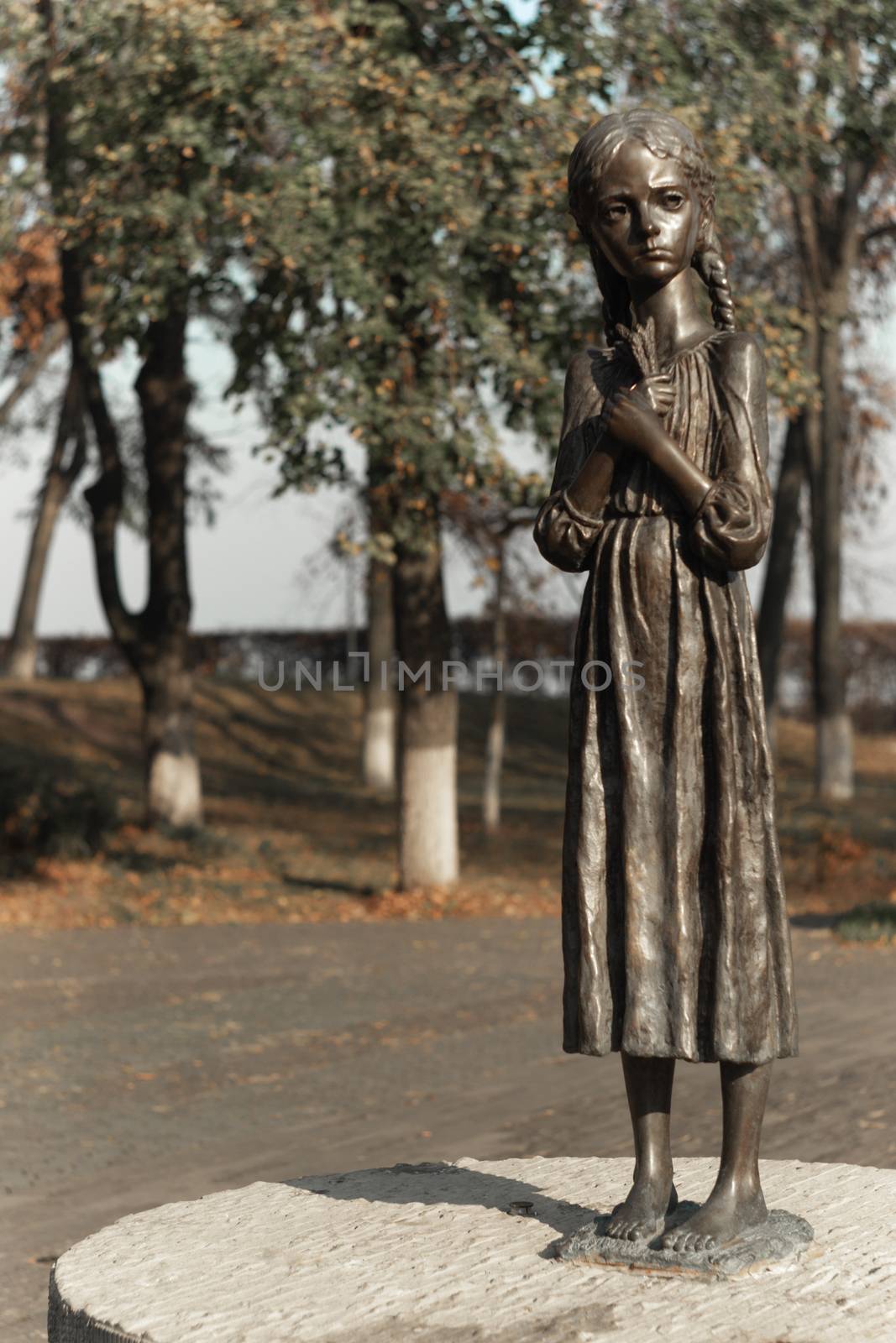 Statue of a very thin hungry girl. Monument to Holocost. Symbol of hungry years. by alexsdriver