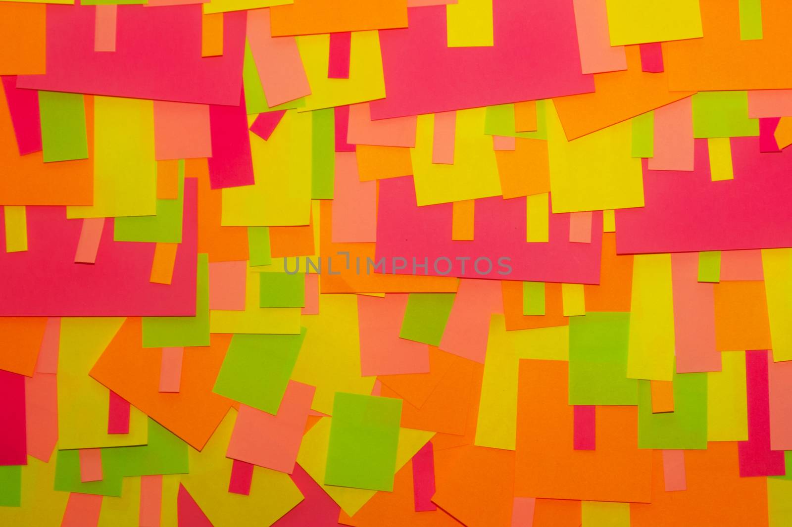 Bright multi-colored stickers on the office white board. by alexsdriver