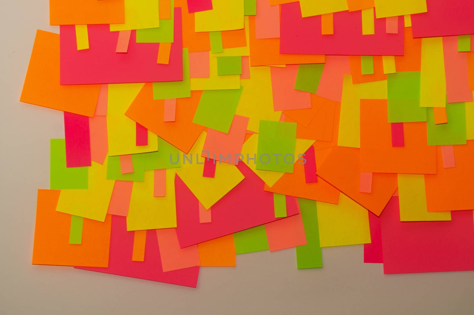 Bright multi-colored stickers on the office white board.