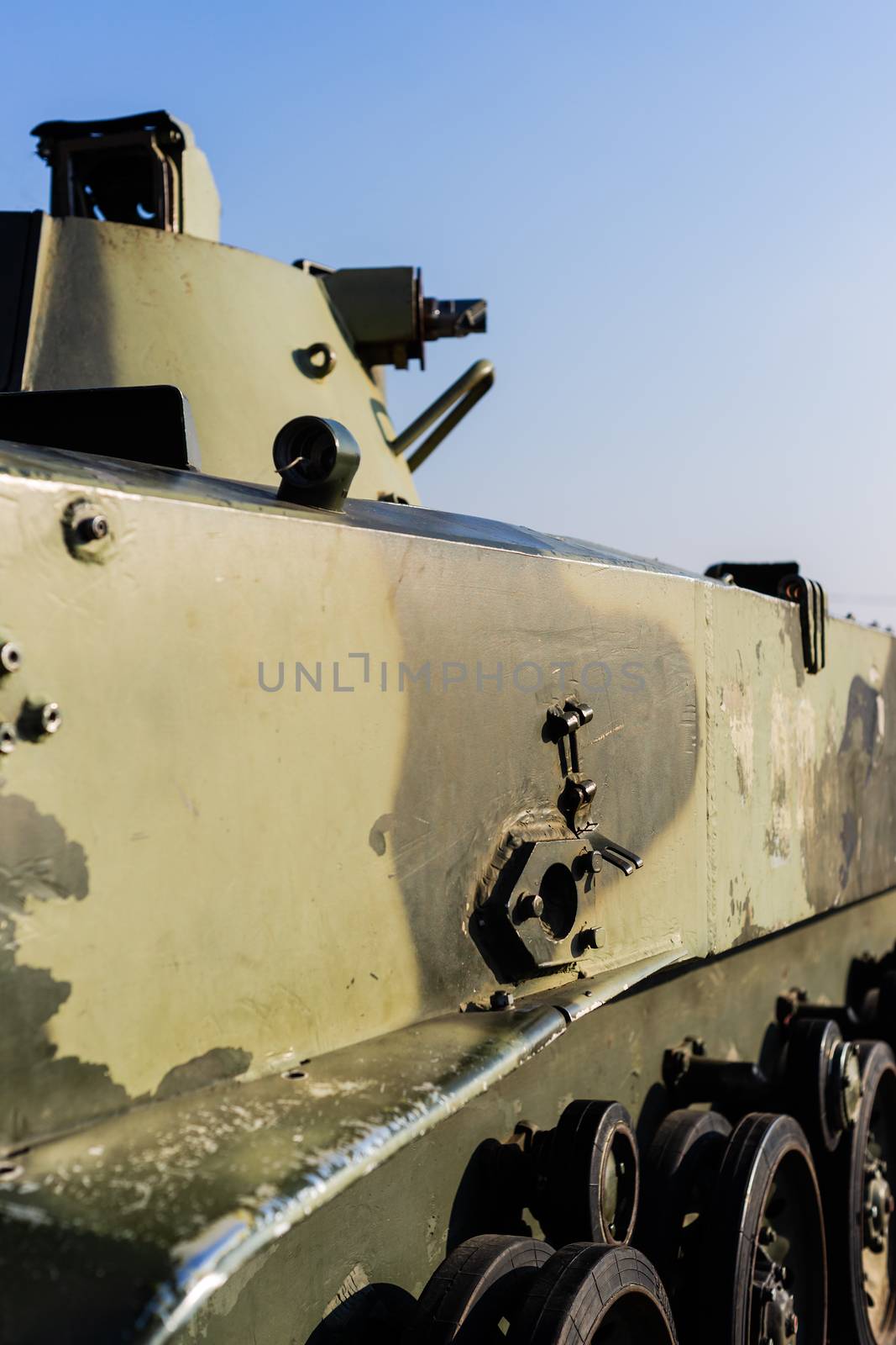 Damaged body of a military armored infantry. Parts of wheelbase vehicle on photo. Outdoor military vehicles museum. Armor is damaged at the battlefield.