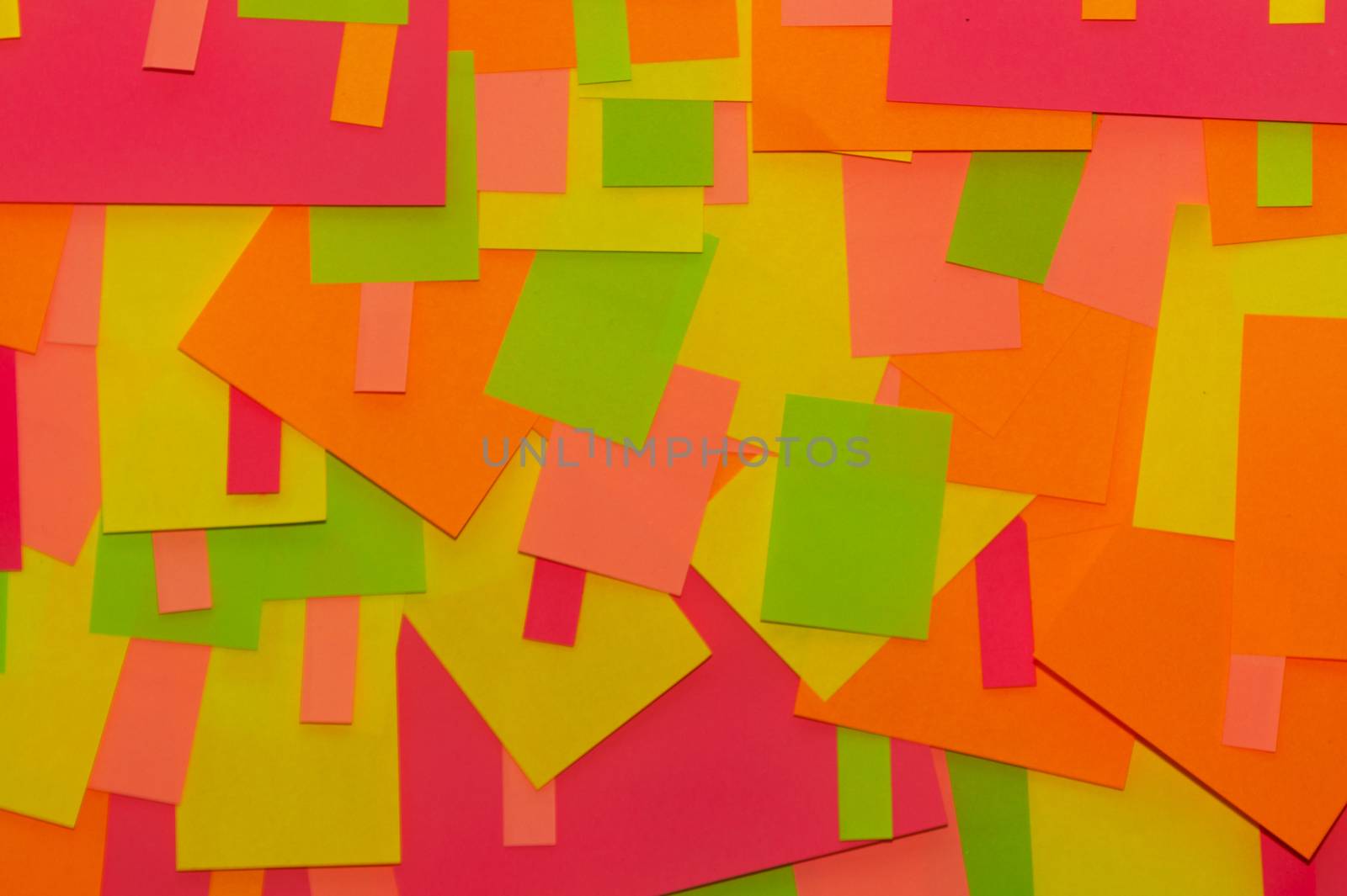 Bright multi-colored stickers on the office white board. by alexsdriver