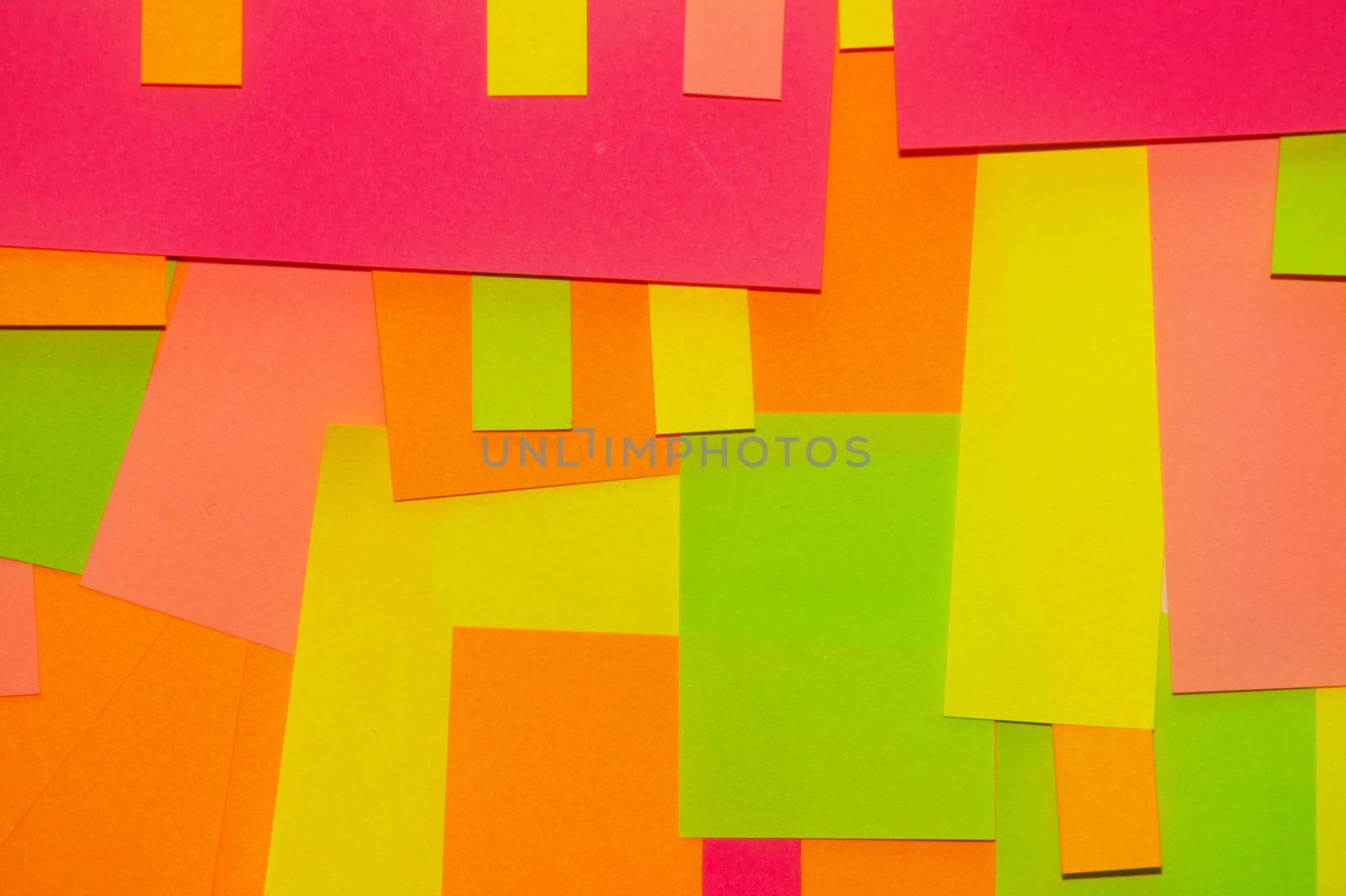 Bright multi-colored stickers on the office white board.