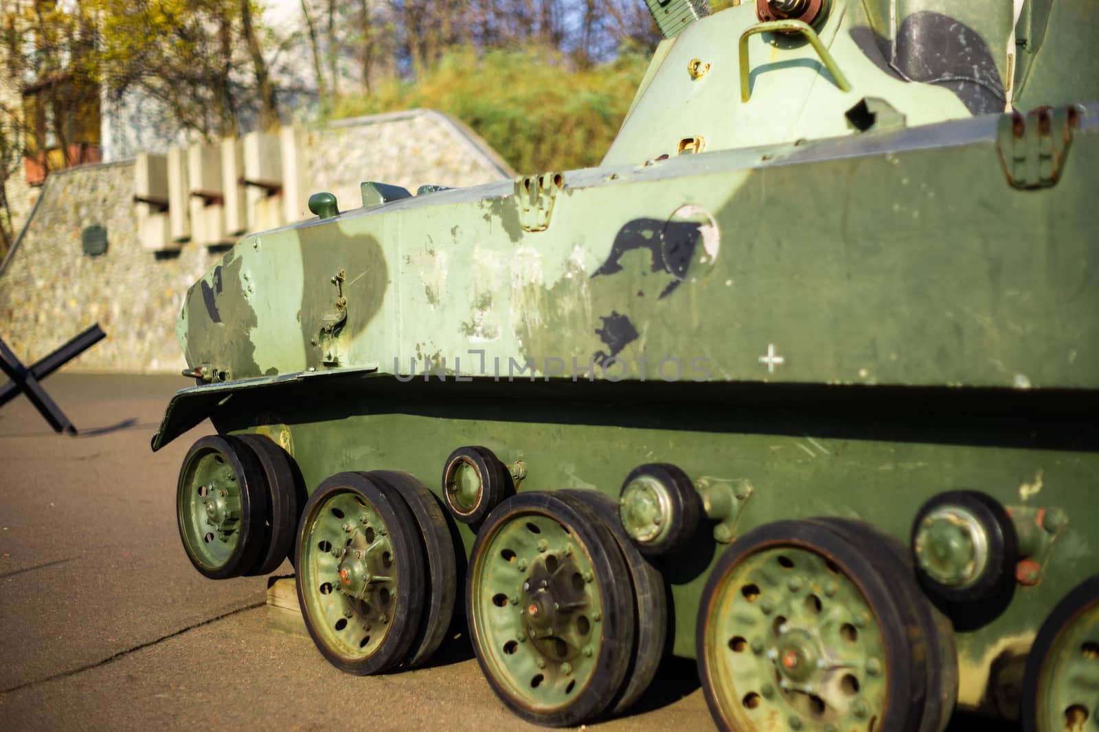 Damaged body of a military armored infantry. Parts of wheelbase vehicle on photo. Outdoor military vehicles museum. Armor is damaged at the battlefield.