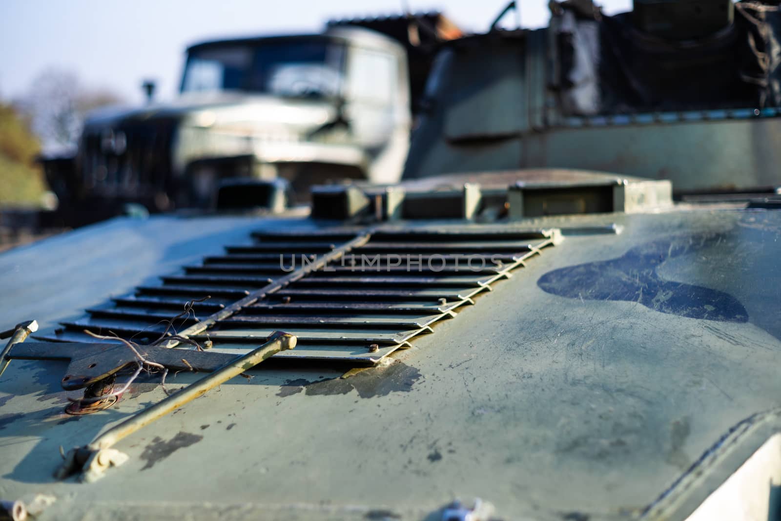 Damaged body of a military armored infantry. Part of  vehicle on photo. Outdoor military vehicles museum. Armor is damaged at the battlefield. by alexsdriver