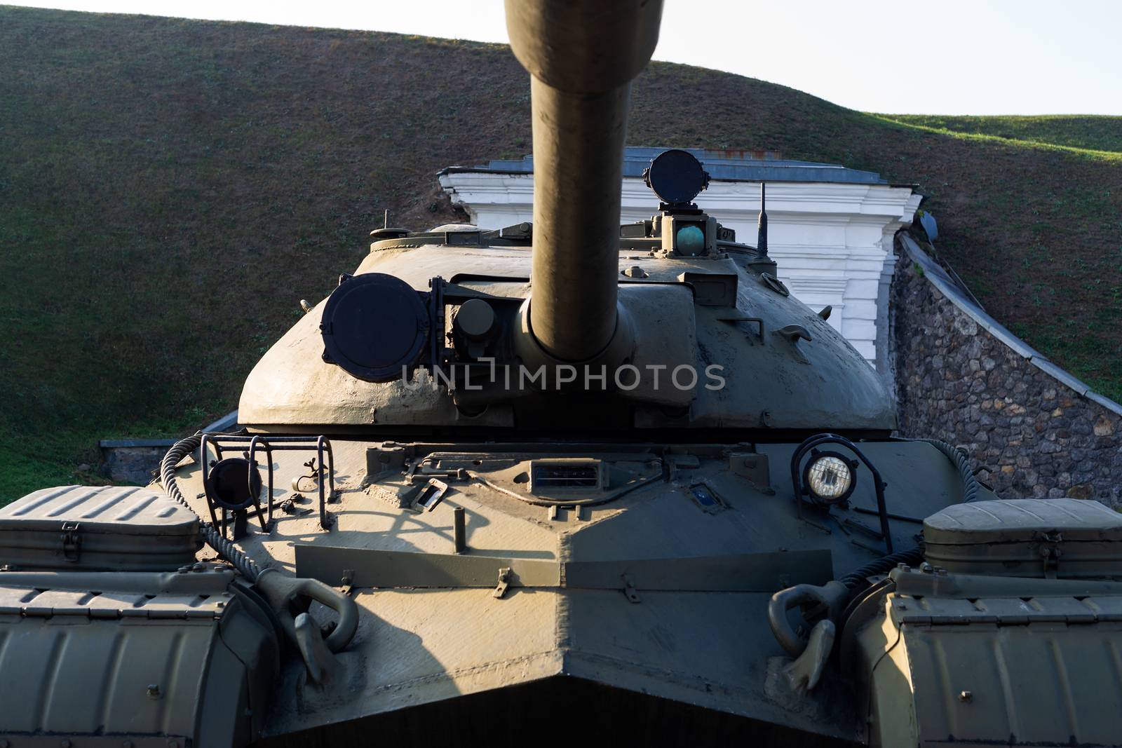 Parts of the hull of the old tank in the museum of military vehicles outdoor in the open air. Gun closeup view. by alexsdriver