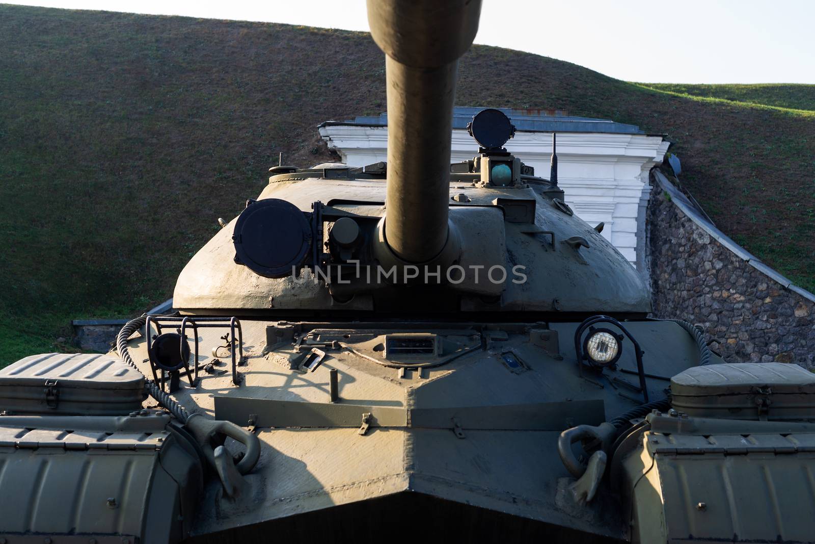 Parts of the hull of the old tank in the museum of military vehicles outdoor in the open air. Gun closeup view.