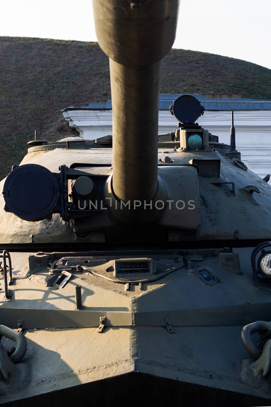 Parts of the hull of the old tank in the museum of military vehicles outdoor in the open air. Gun closeup view.