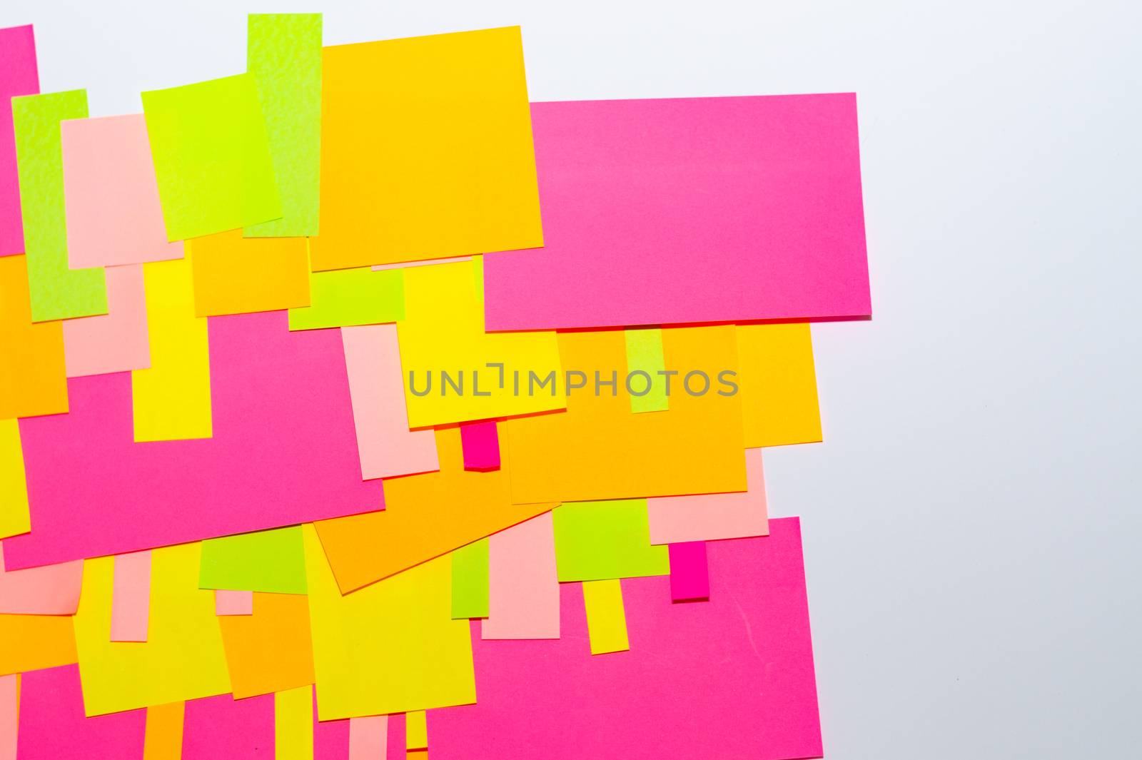 Bright multi-colored stickers on the office white board.