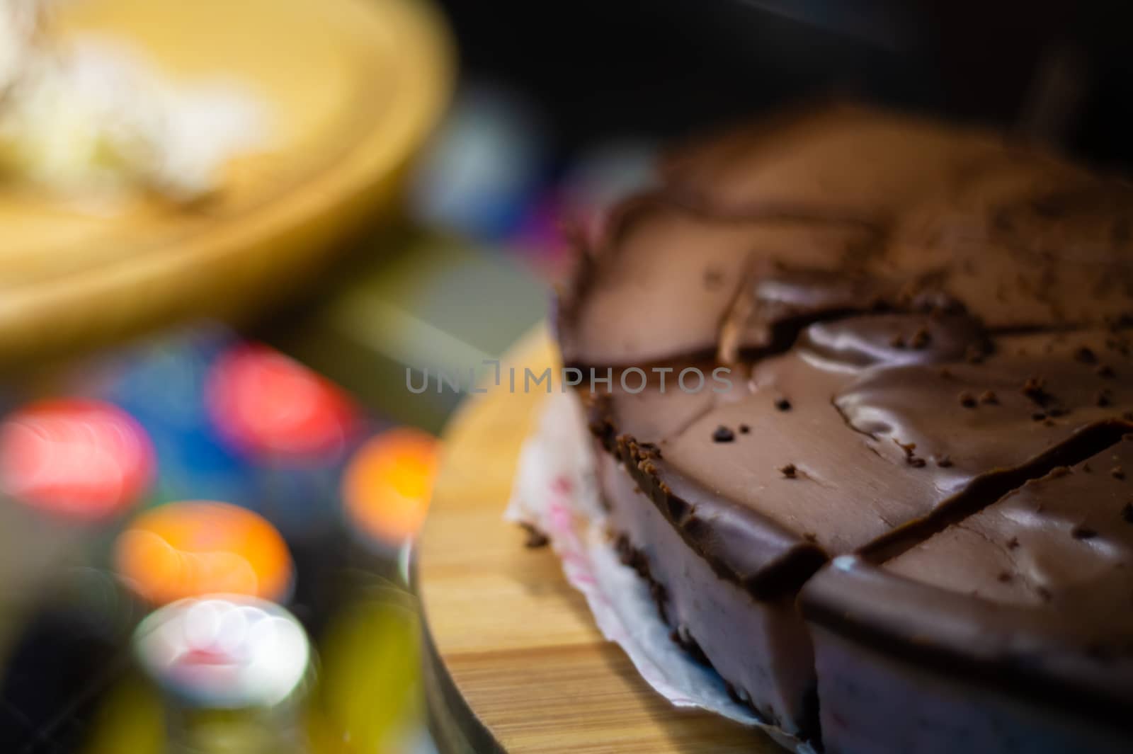 Low light photo some pieces of fresh pie in confectionery fridge on blurred background. Close-up view. by alexsdriver