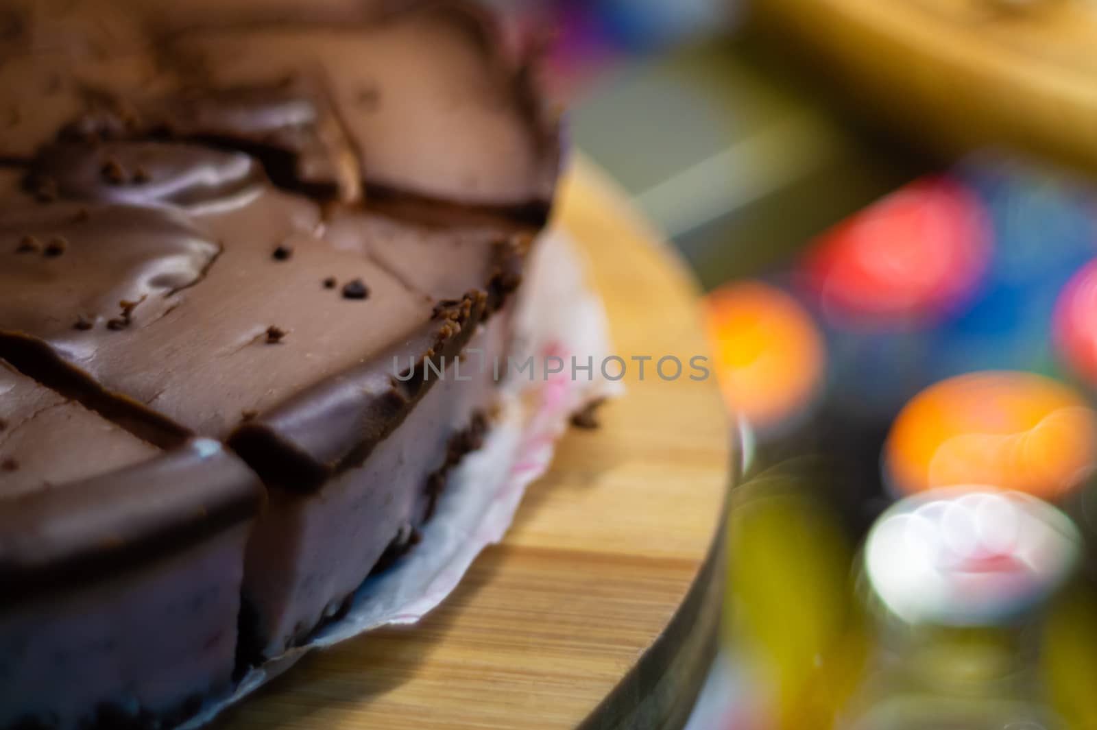 Low light photo some pieces of fresh pie in confectionery fridge on blurred background. Close-up view.