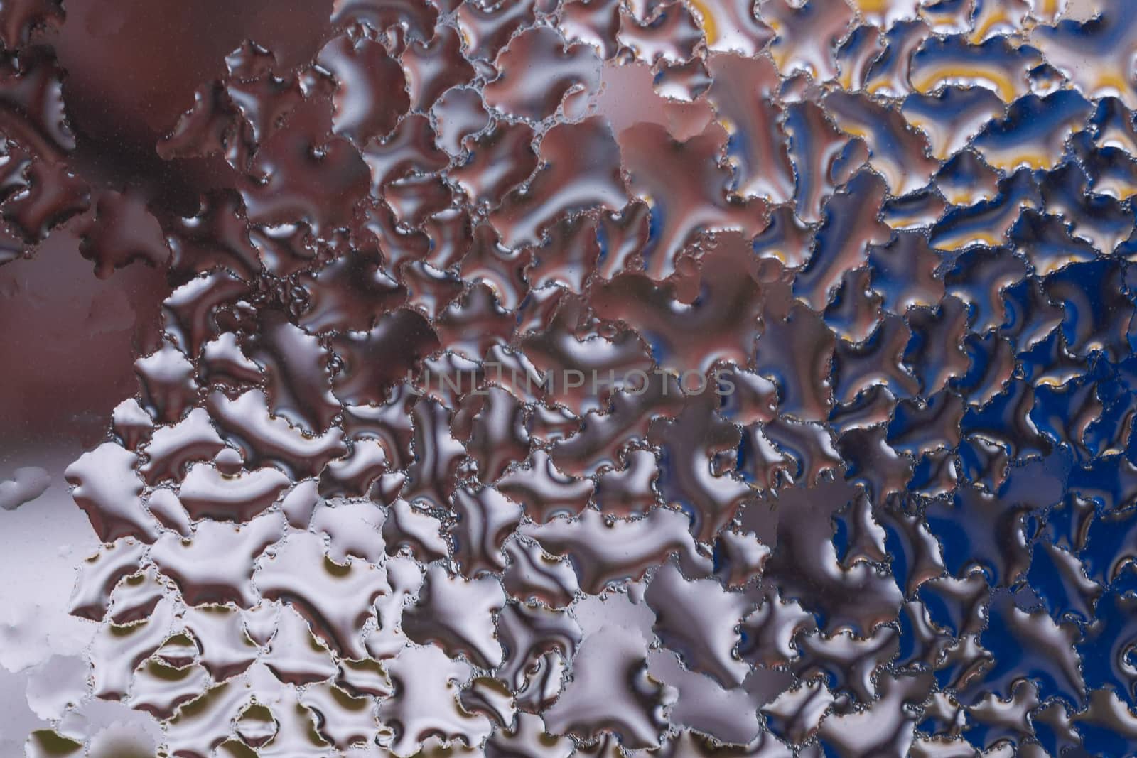 Water drops on glass window close up with blurred background. Drops in macro. Condensate on window closeup. Wet air.