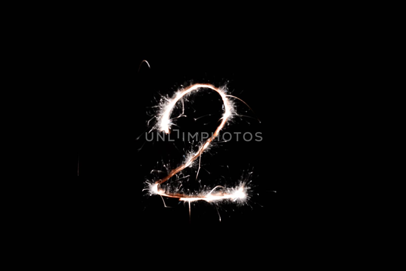 Long exposure underexposed photo of lightpainting bengali fire number two 2. Lighdrawing photo. Soft focus and a lot of lines.