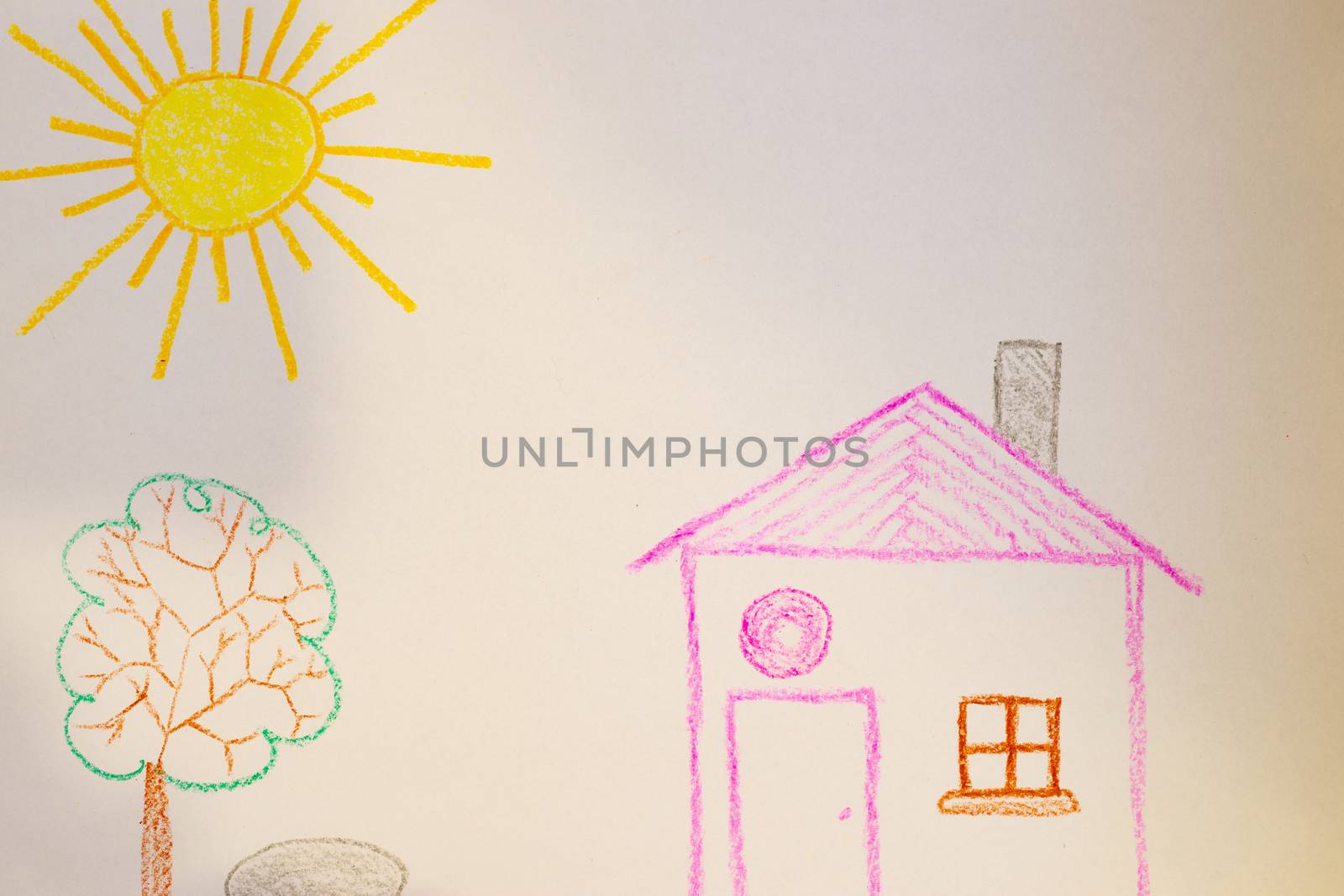Children`s drawing of house, tree, sun and rock on white paper. Kindergarten age drawings.