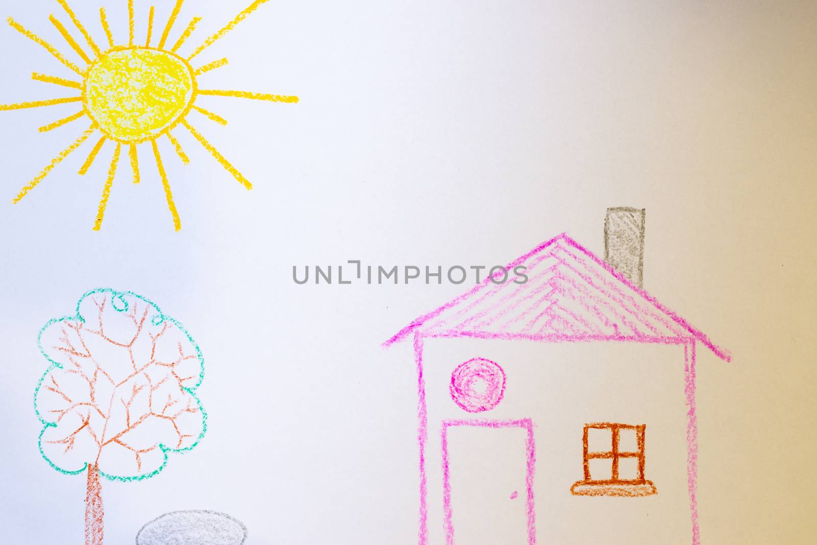 Children`s drawing of house, tree, sun and rock on white paper. Kindergarten age drawings.
