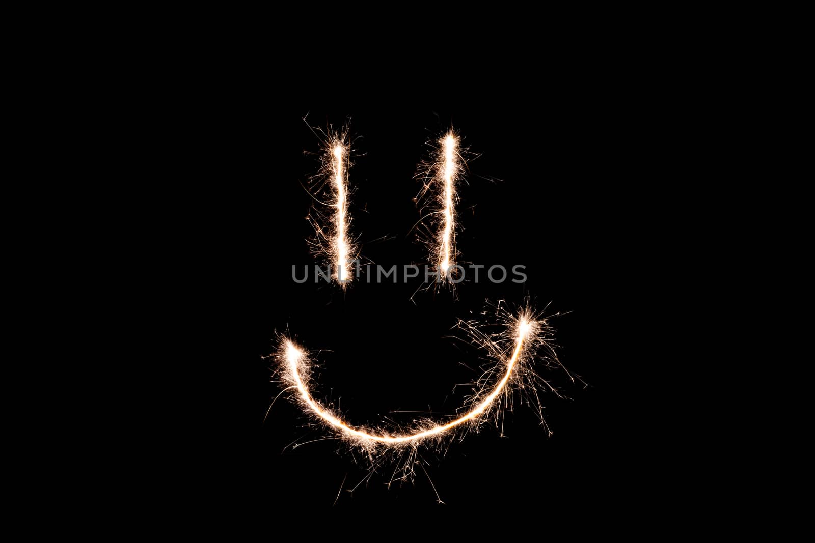 Long exposure underexposed photo of lightpainting bengali fire. Lighdrawing photo. Soft focus and a lot of lines. Smile on photo