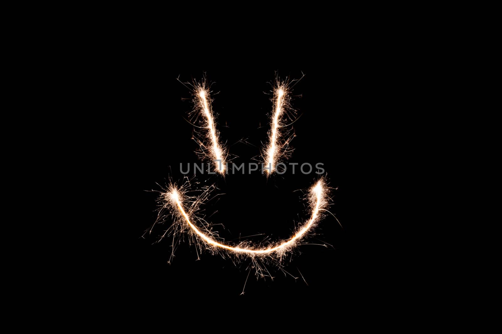Long exposure underexposed photo of lightpainting bengali fire. Lighdrawing photo. Soft focus and a lot of lines. Smile on photo