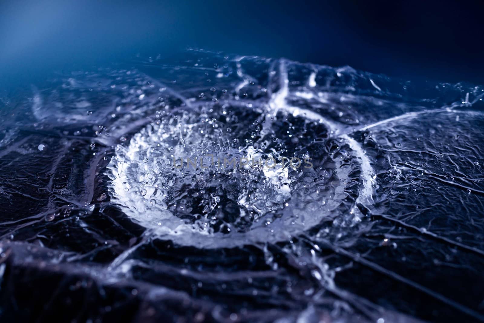 Water drops splashing on acoustic membrane. A lot of drops in air. High frequency of sound waves. Water cloud small drops. Frozen time shot.