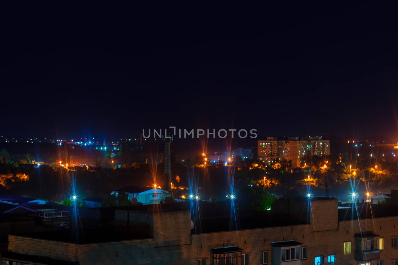 Long exposure night photo. A lot of stars with trees on foreground. Far from the city. Night landscape.