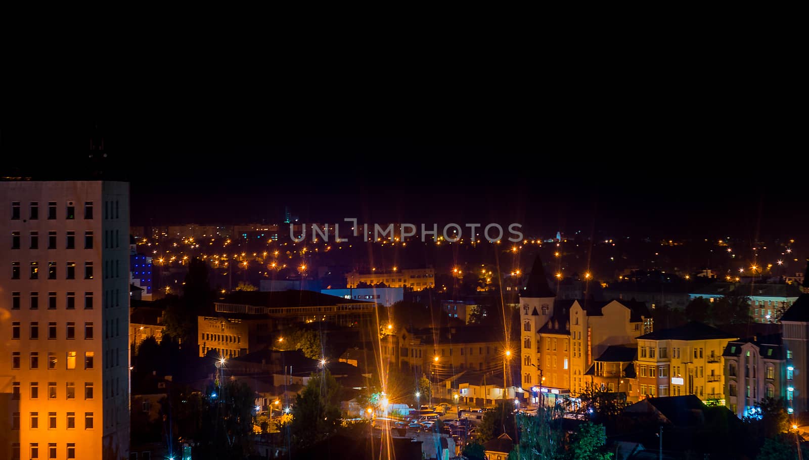Long exposure photo big city life at night. High view above the city.