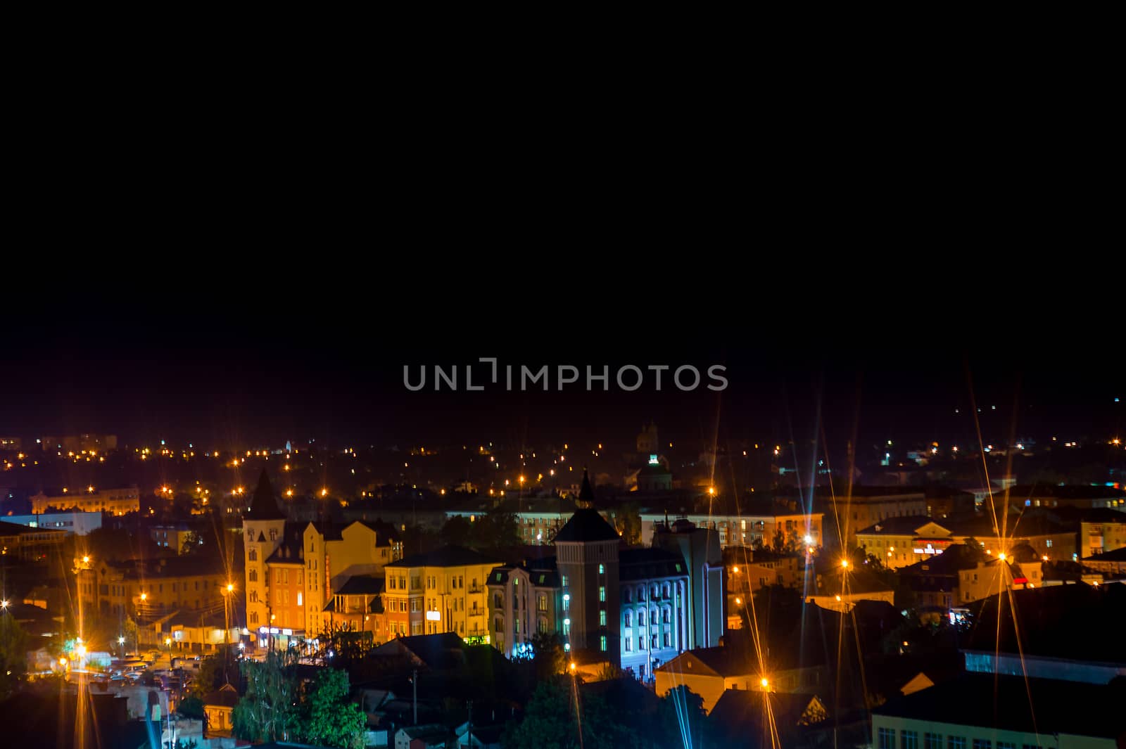 Long exposure photo big city life at night. High view above the city.