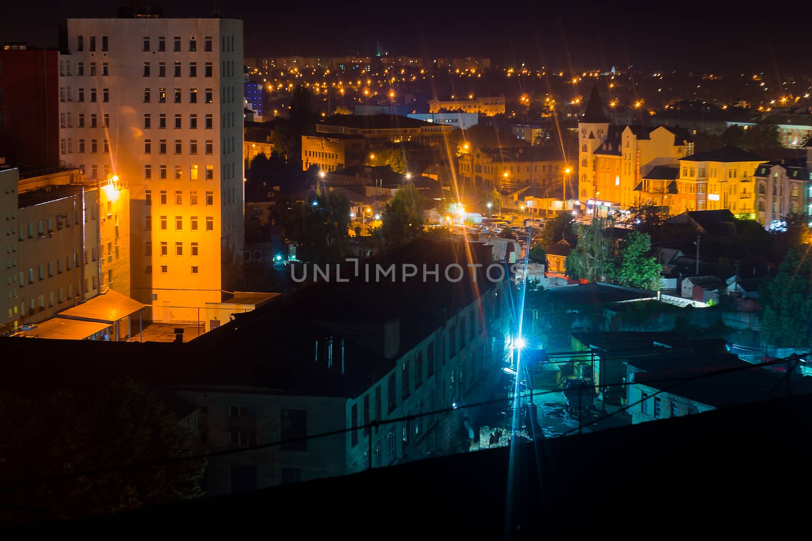 Long exposure photo big city life at night. High view above the city.