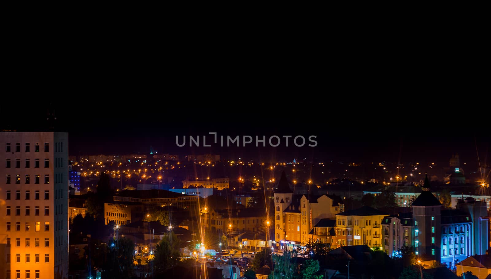 Long exposure photo big city life at night. High view above the city.