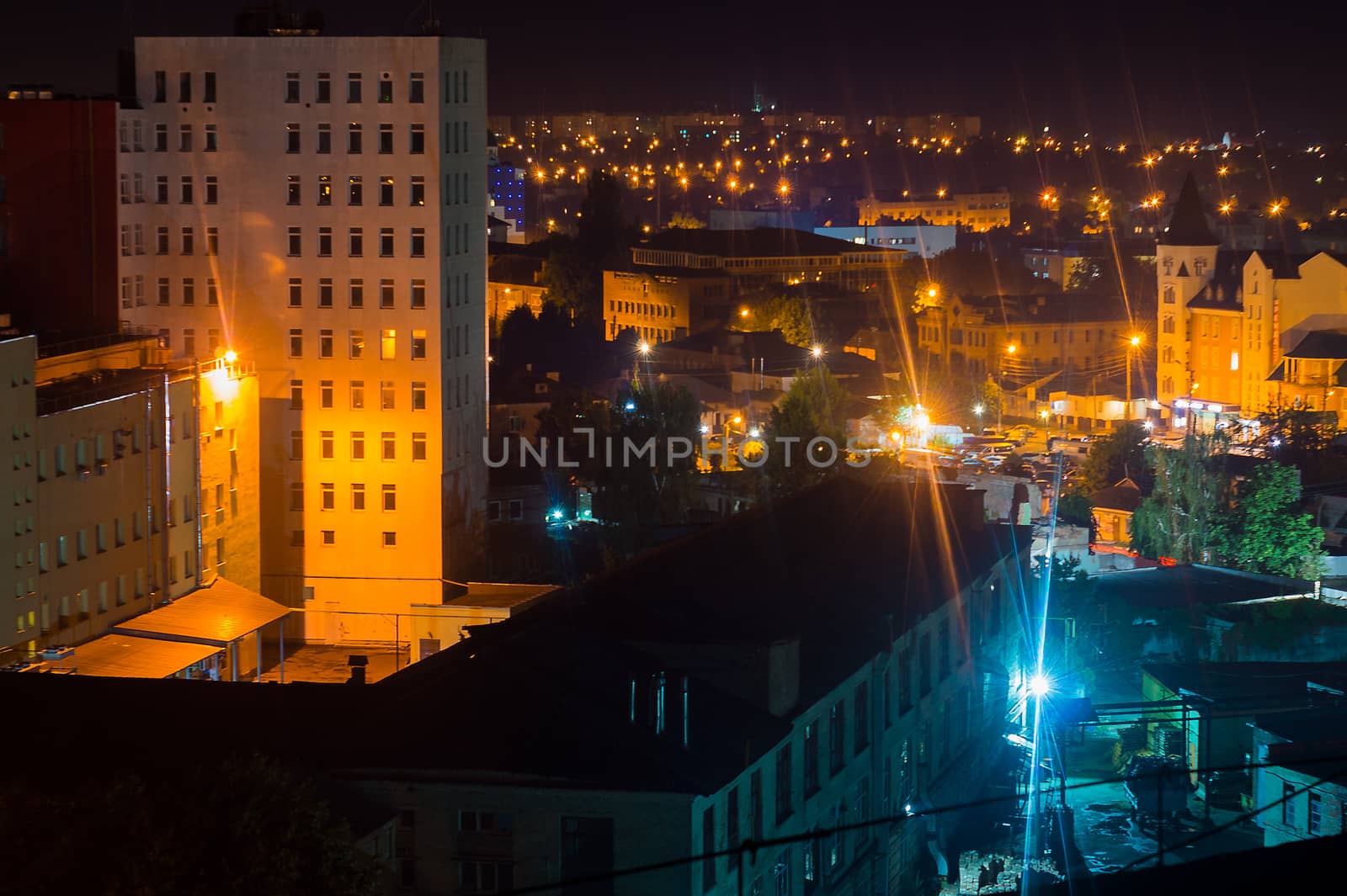 Long exposure photo big city life at night. High view above the city.