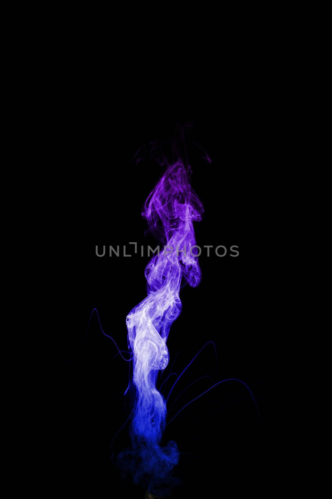 Dual colour vape steam column with spray boiling liquid. Blue and purple colour smoke. Stock photo isolated on black background.