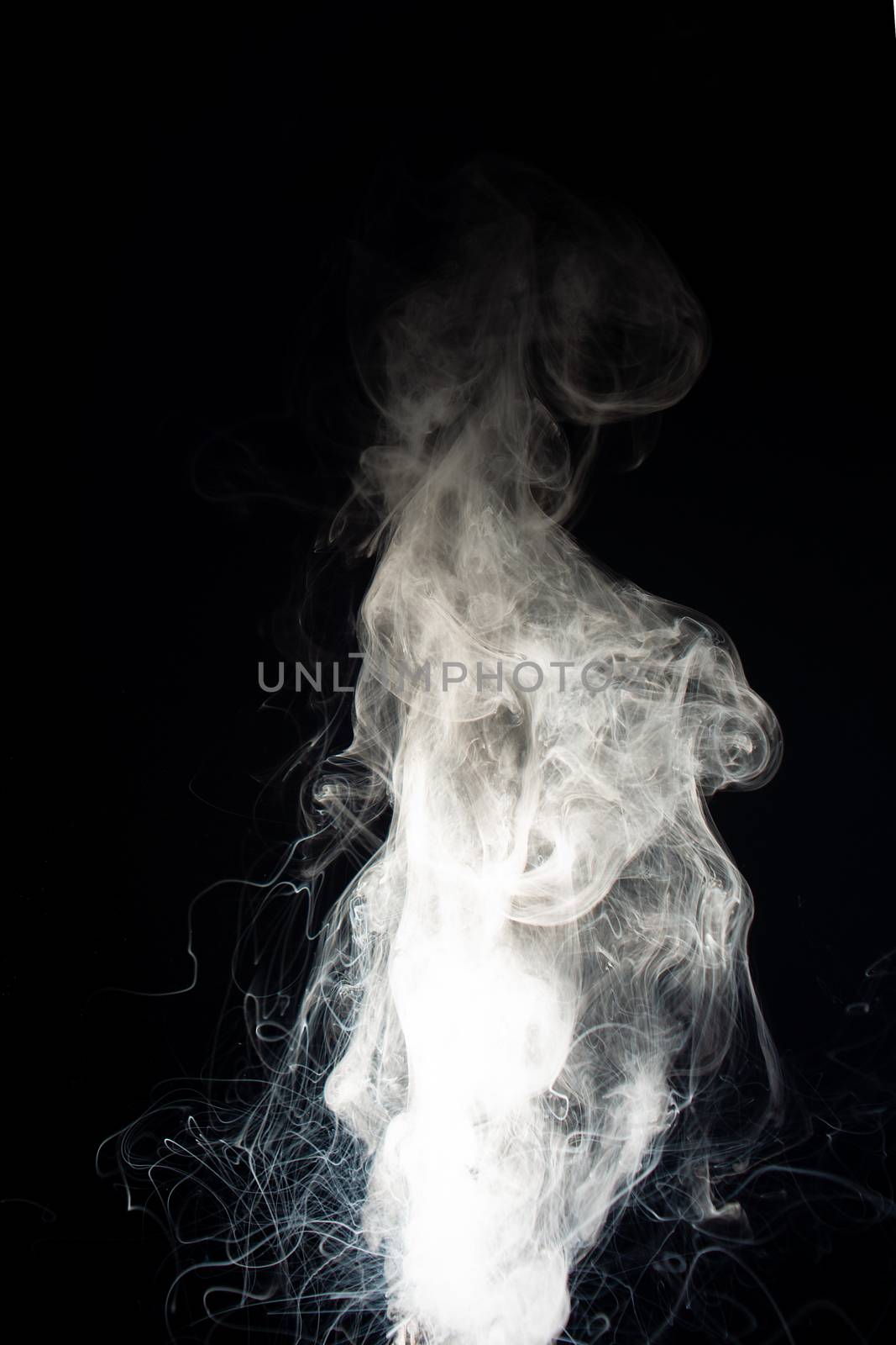 Column of vape clouds splash on black background. A lot of lines of smoke. White fog is tight. Stock isolated white smoke with spray boiling liquid.