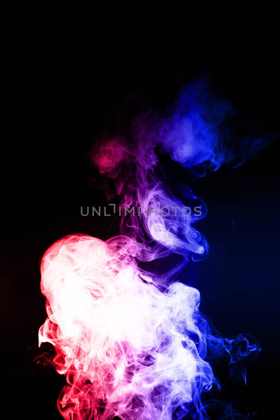 Colorful cloud splash with spray boiling liquid. Two colours fog is hue blue and hue red. Stock photo isolated on black background.