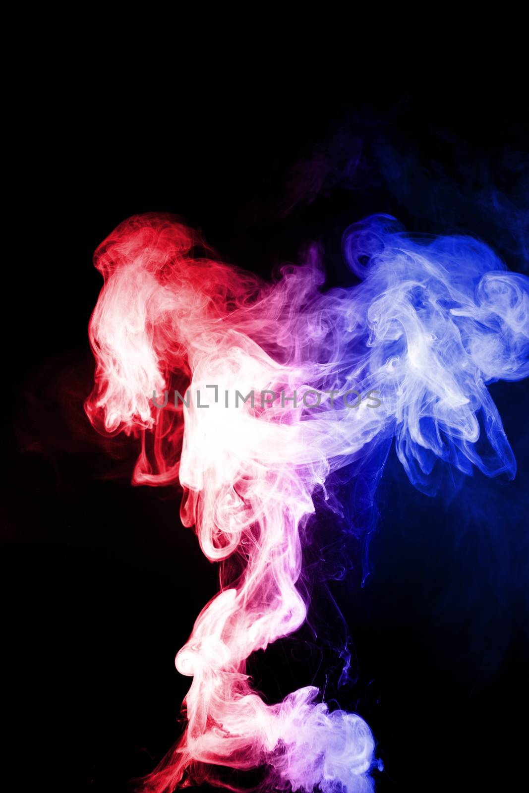 Column of vape clouds splash on black background. A lot of lines of smoke. Two colours fog is blue and red. Stock isolated color smoke with spray boiling liquid.