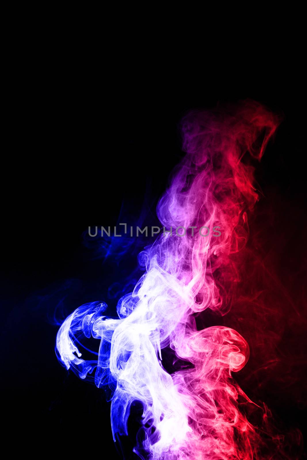 Colorful cloud splash with spray boiling liquid. Two colours fog is hue blue and hue red. Stock photo isolated on black background.