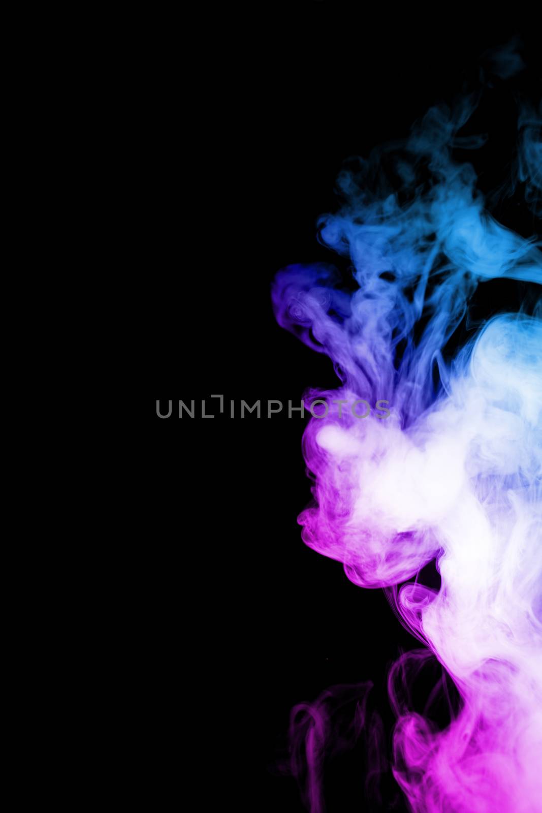 Vape clouds splash with two colours fog is blue and purple colour. Low light photo. Stock isolated on black background color smoke with spray boiling glycerine lines.