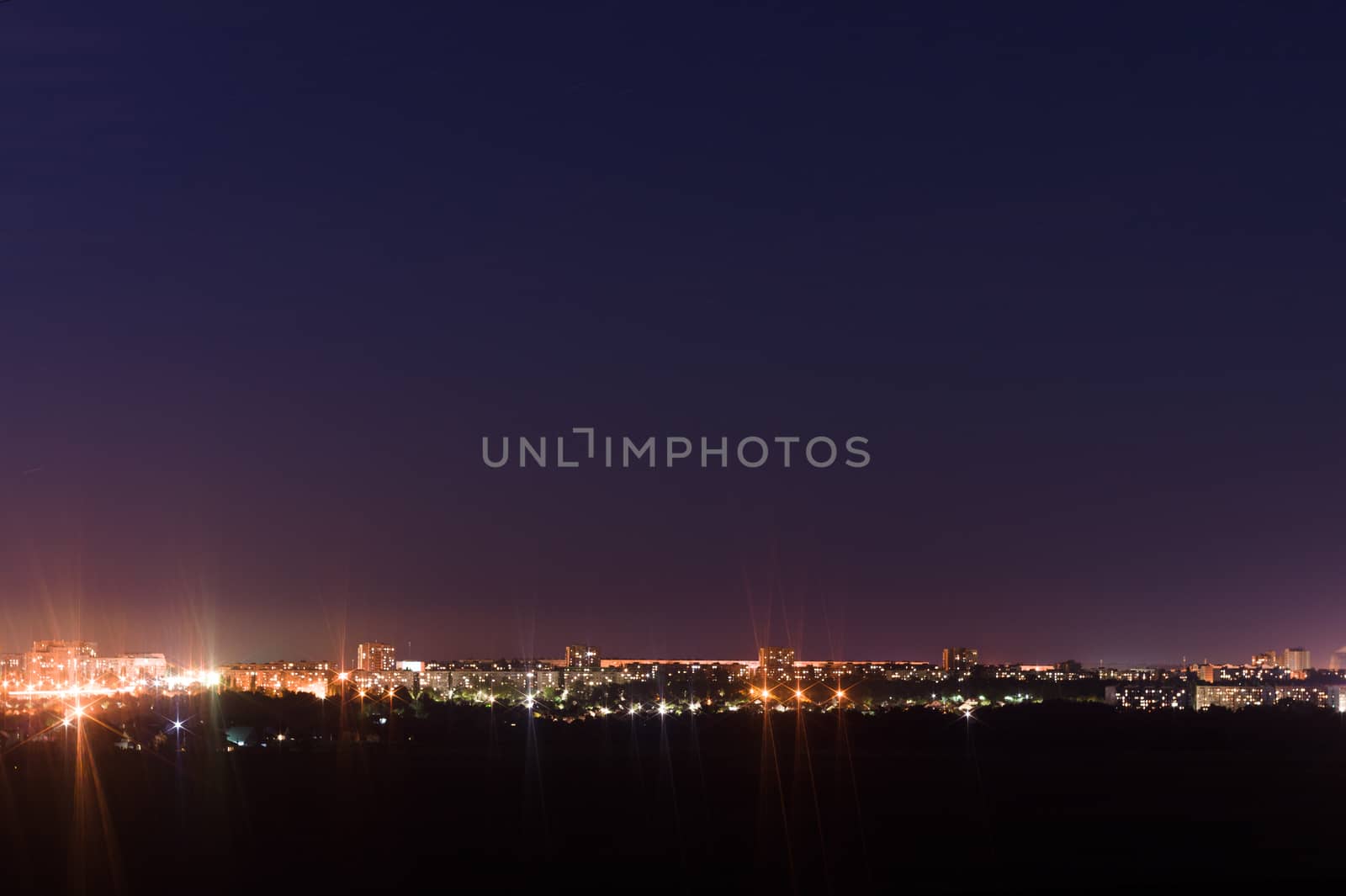 Long exposure night photo. A lot of stars with trees on foreground. Far from the city. Night landscape.