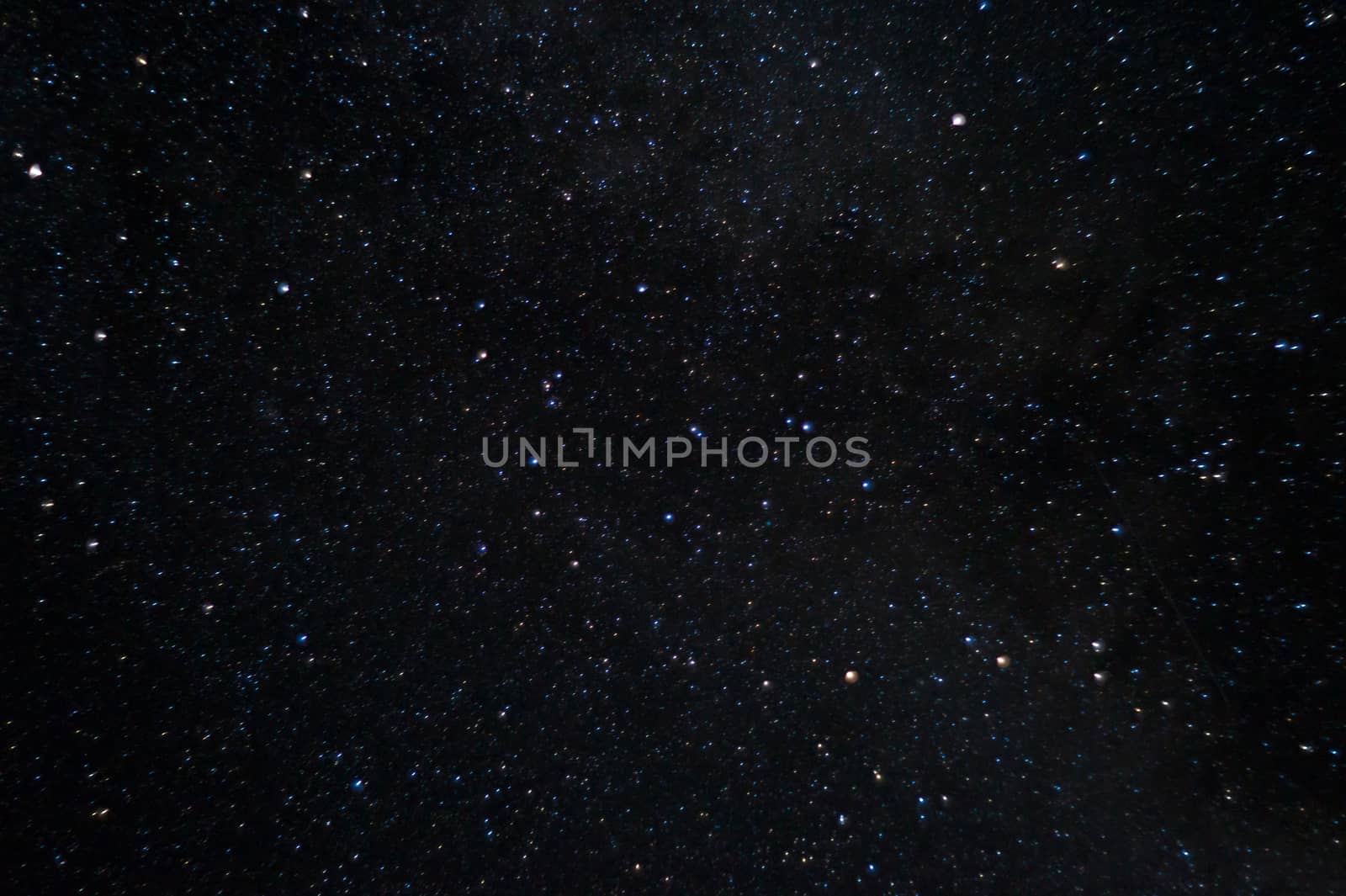 Long exposure universe night photo. A lot of stars with constellations. Far from the city. Night landscape.