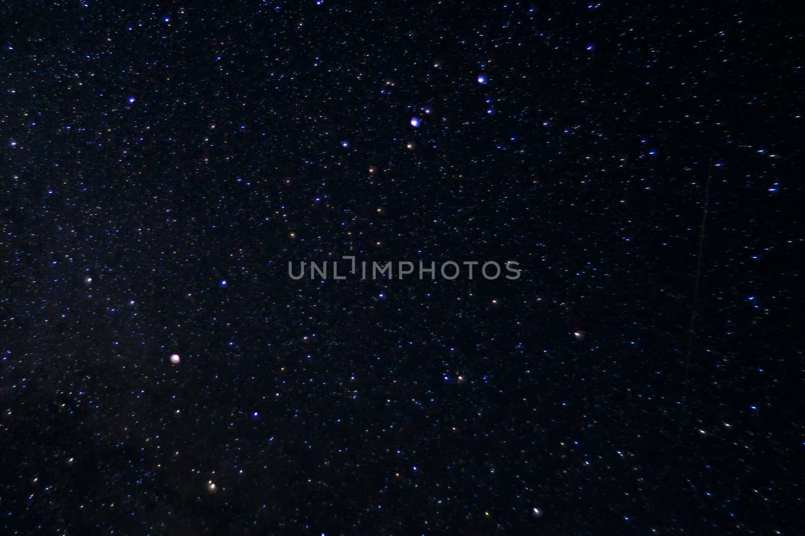 Long exposure night photo. A lot of stars with constellations. Far from the city. Night landscape.