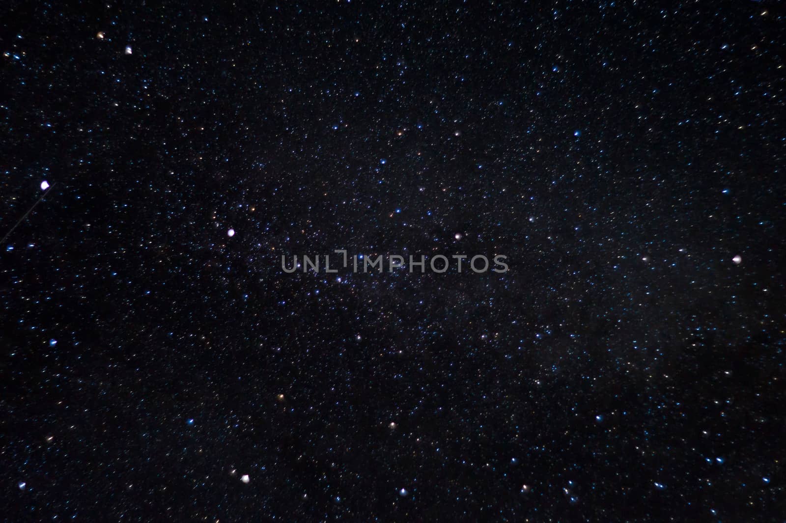 Long exposure night photo. A lot of stars with constellations. Far from the city. Night beautiful landscape.