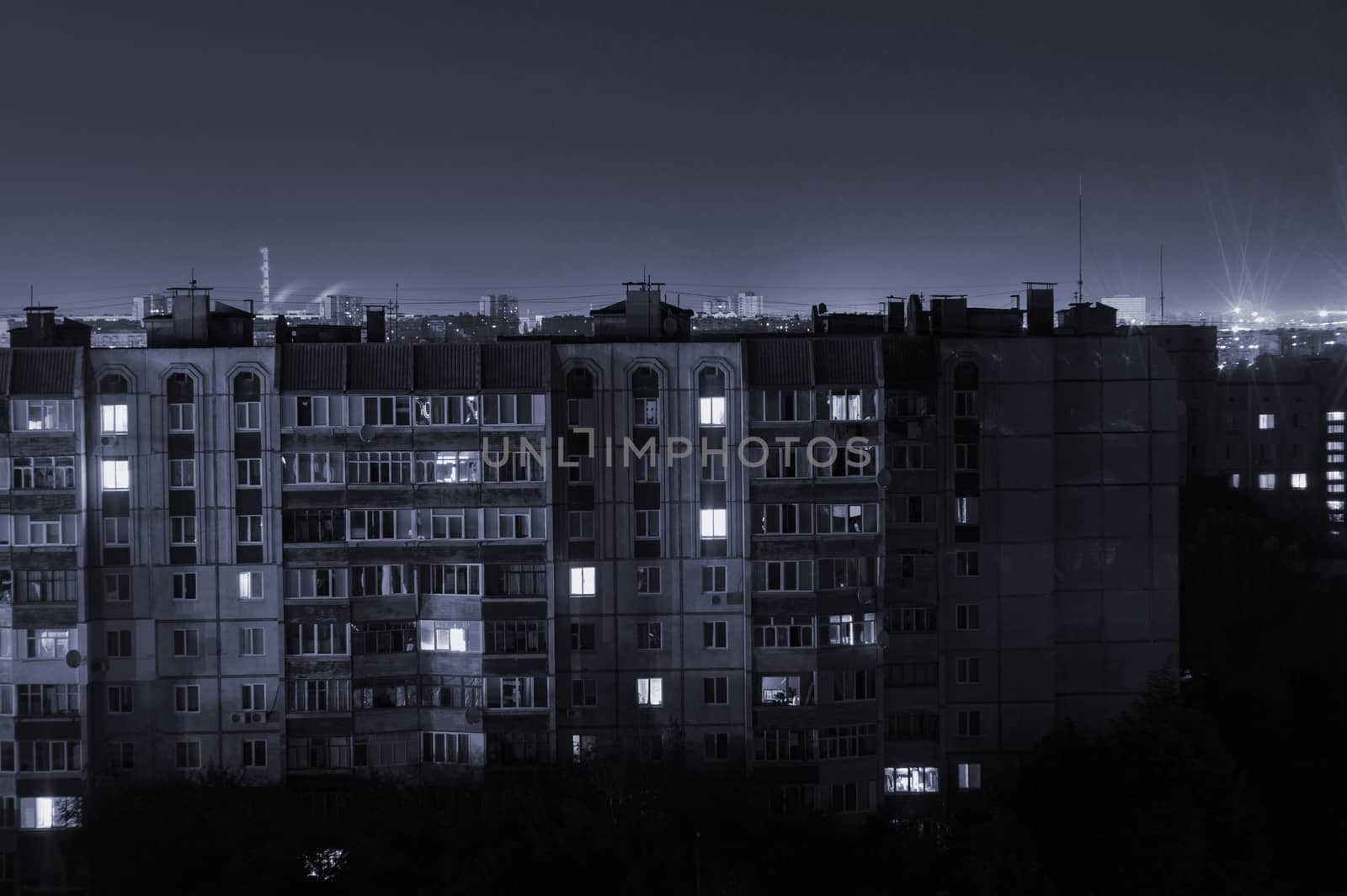 Night long exposure photo 9 and 10 floors high-rise buildings in black and white colours. Big city life is here!