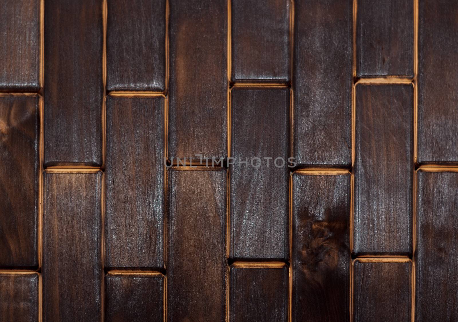 Wooden charred floor of small plates. View from above. Floor as an element of the interior.