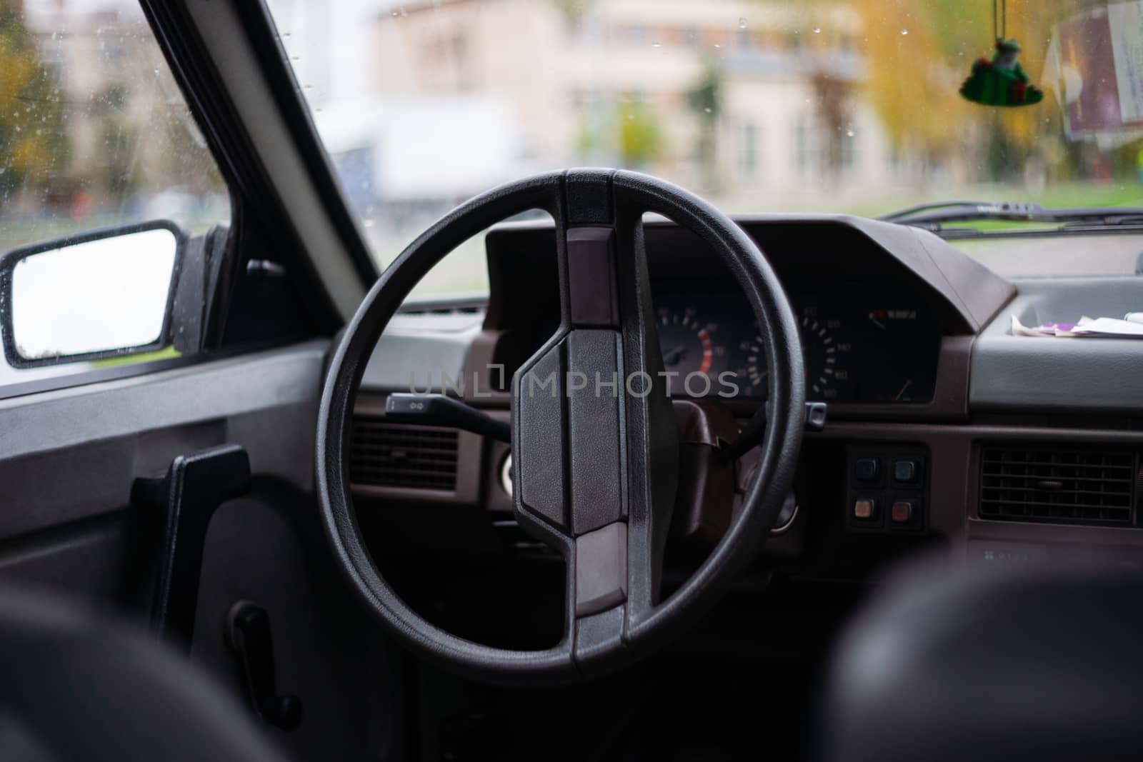 USSR 1980`s old car. Wheel, mirror and digital panel in frame. Retro car born in USSR.