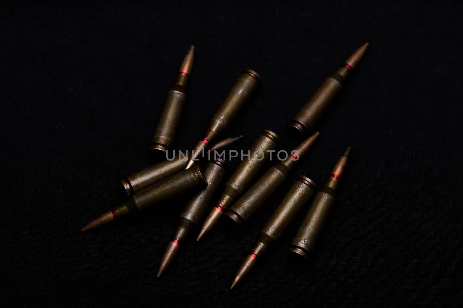 Rifle military ammo on black background. Symbolizes war for money- biggest problem in world.