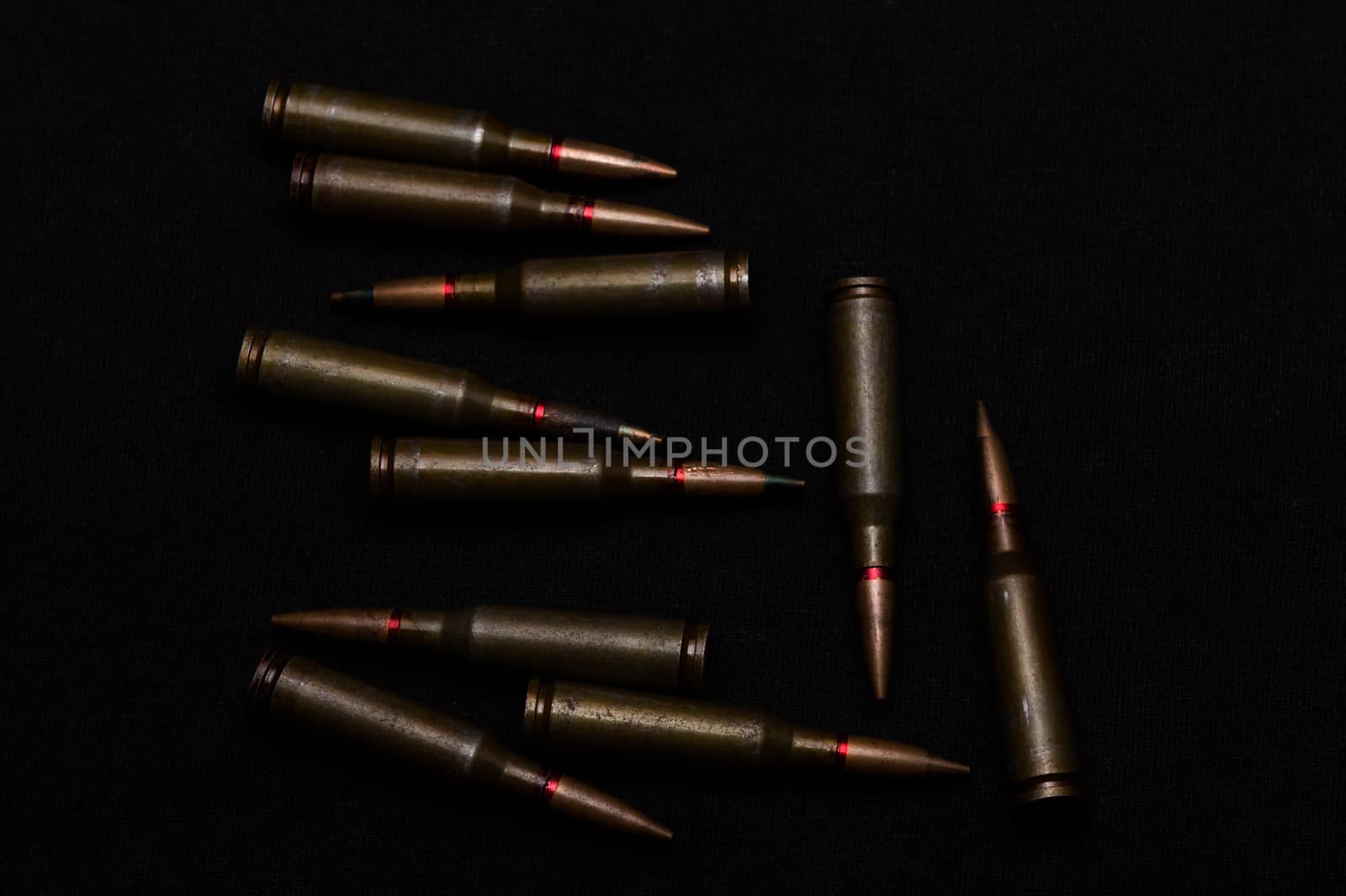 Rifle military ammo on black background. Symbolizes war for money- biggest problem in world.