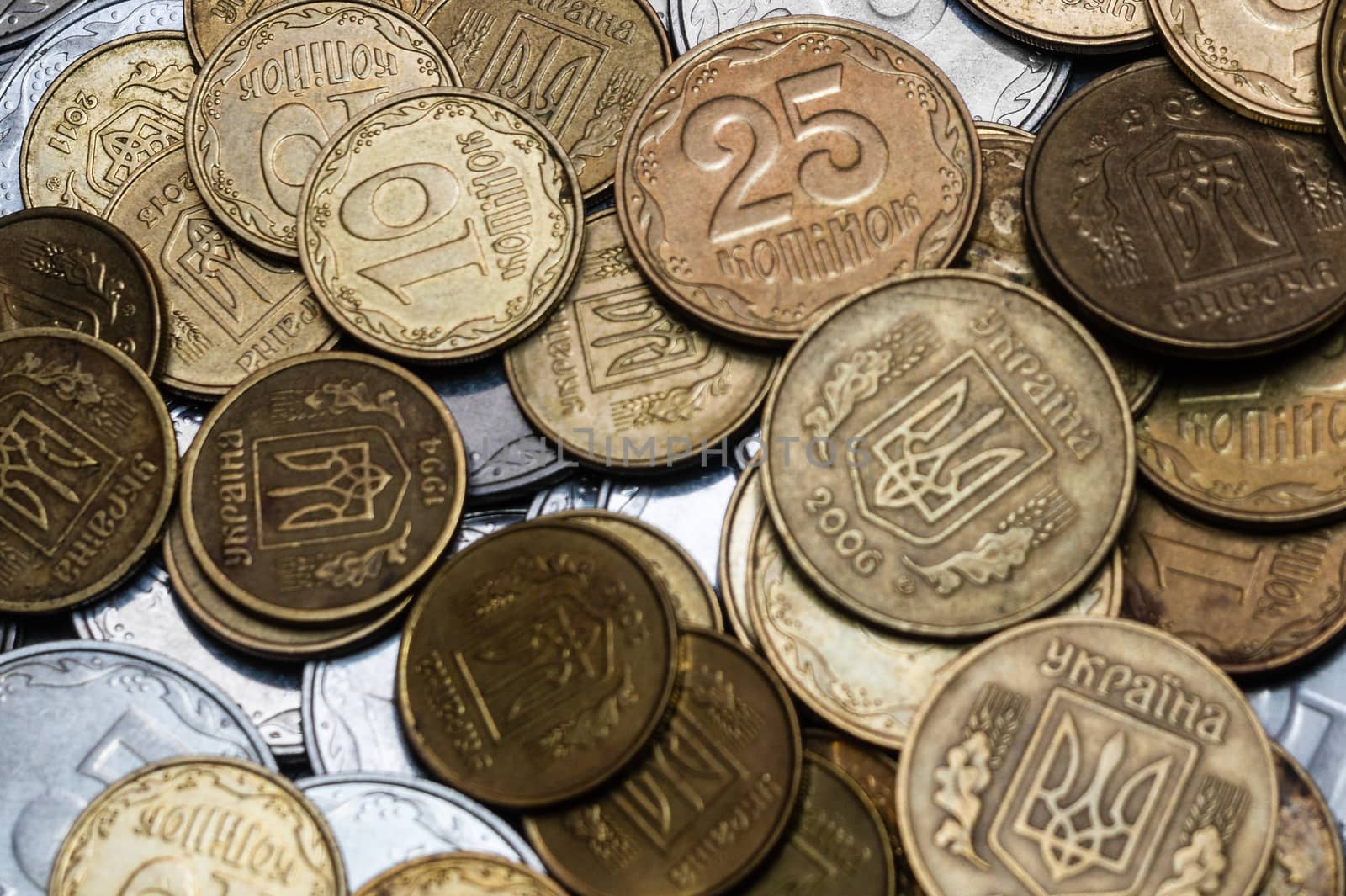 Ukrainian coins isolated on black background. Close-up view. Coins are located in the center of frame. A conceptual image.